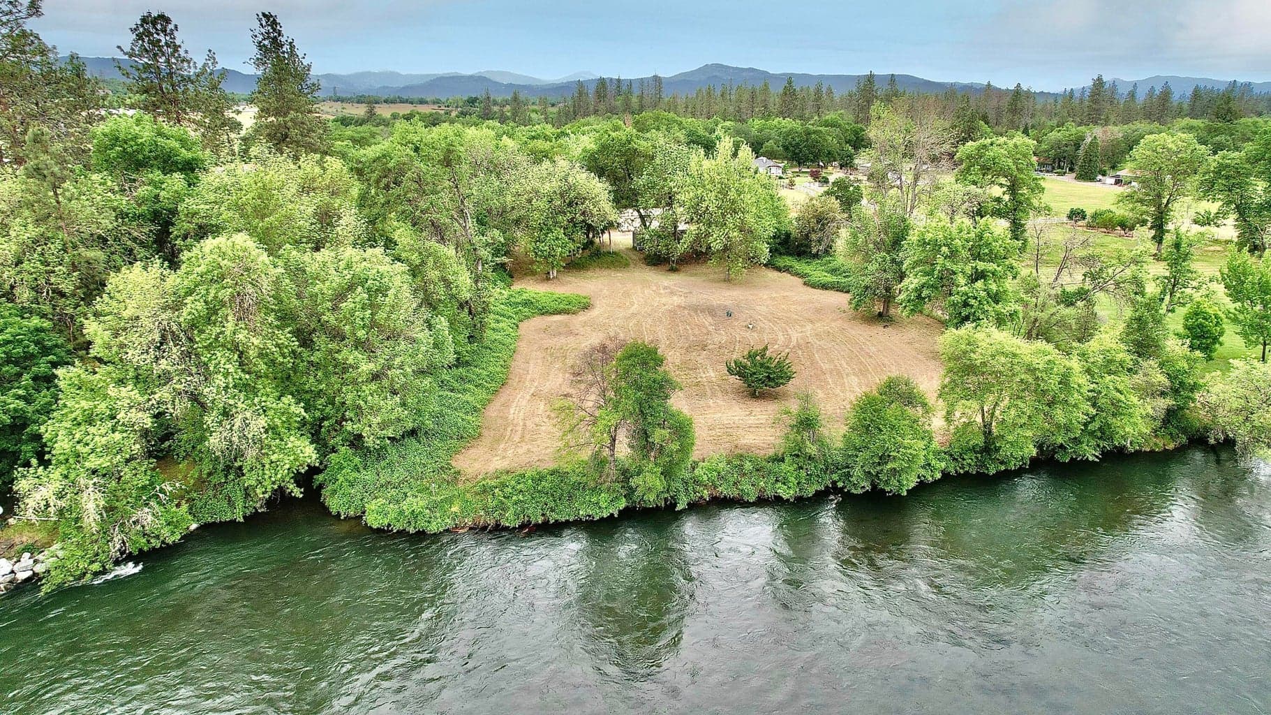 Looking back at the property on the 10.02 acre lot from the East Bank to the Front Yard