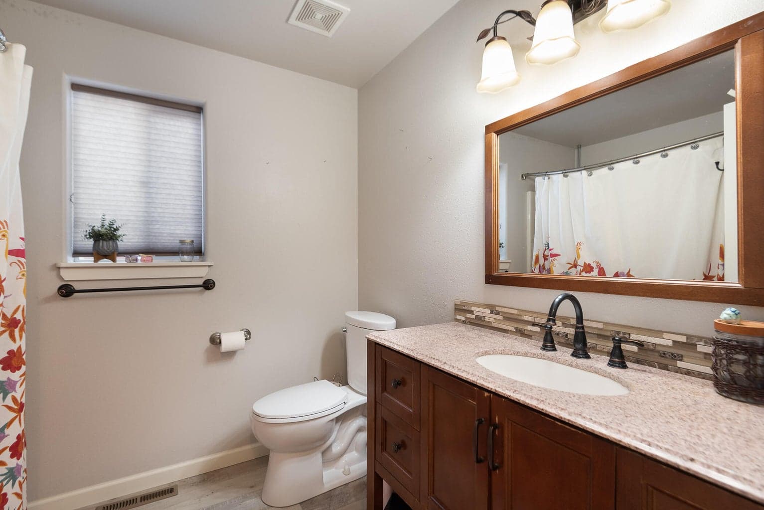 Guest bath and 2 additional bedrooms grace the southern end of the home.