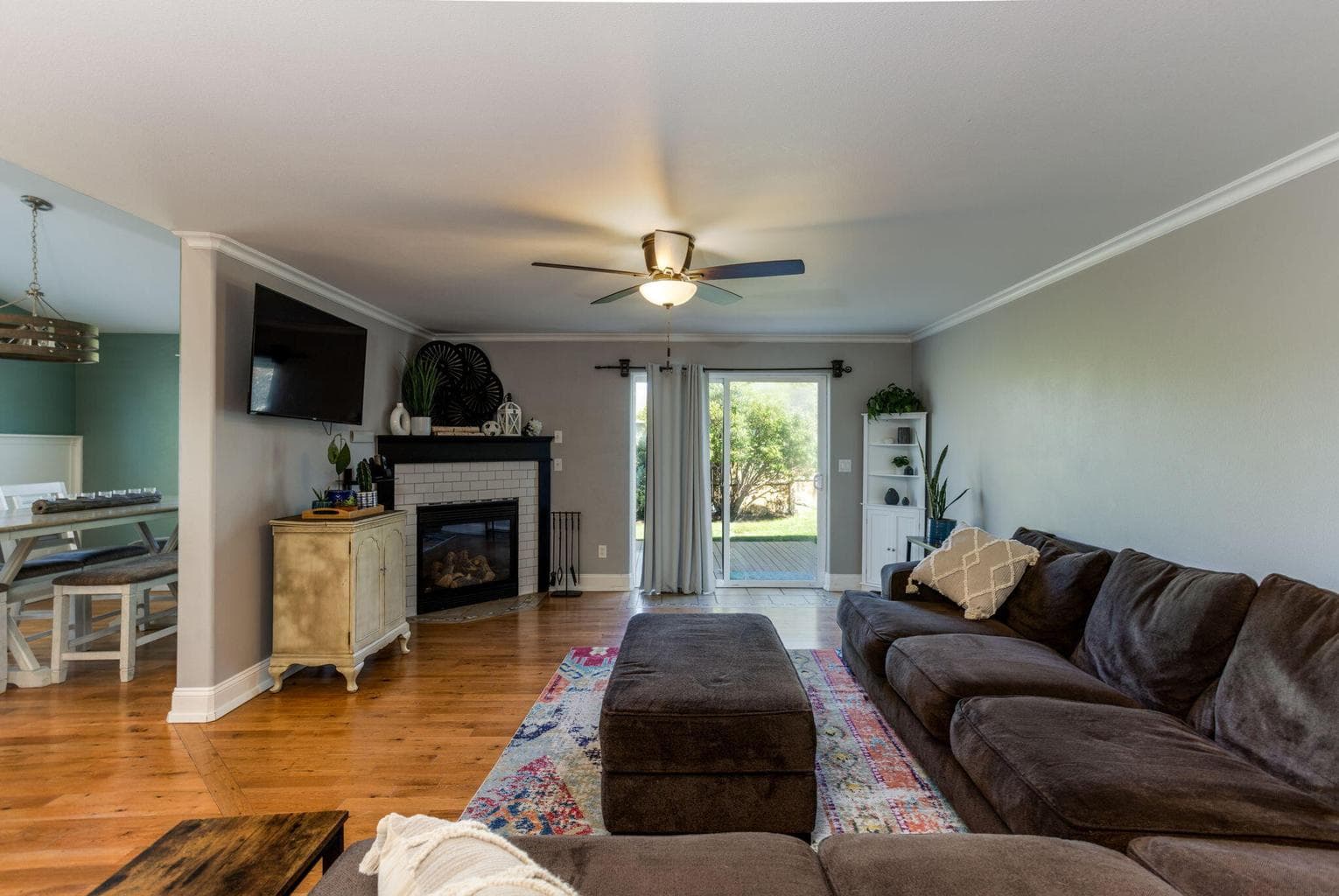 Huge living room on main, with sliding doors to backyard deck and gas fireplace.