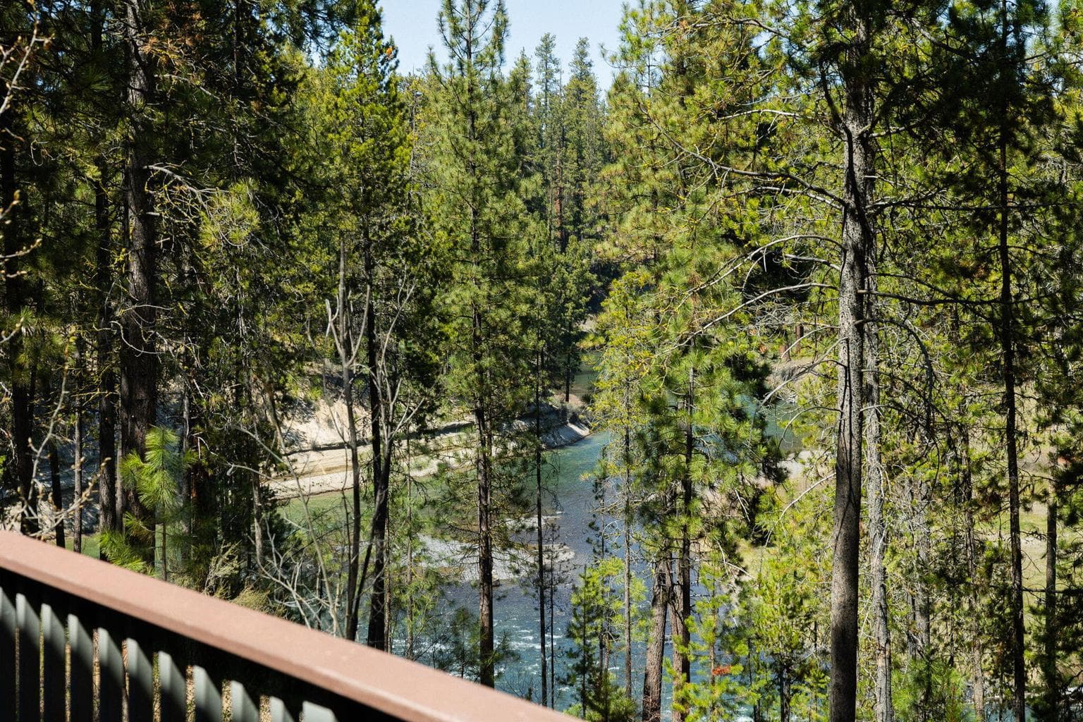 Views from the deck of the slower moving north section of Pringle Falls as it winds towards Sunriver and beyond.