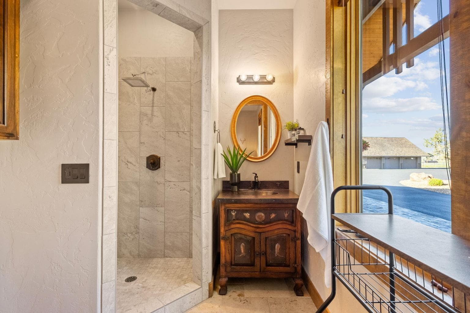 Ensuite bathroom in bedroom 3 with walk in tile shower and custom vanity.