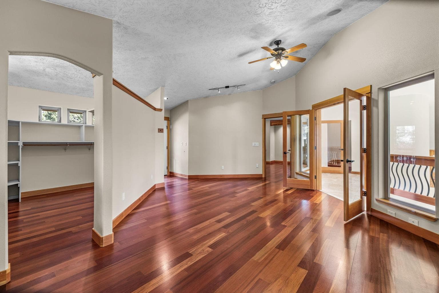 French doors from Primary open to atrium balcony level - perfect for plants!!