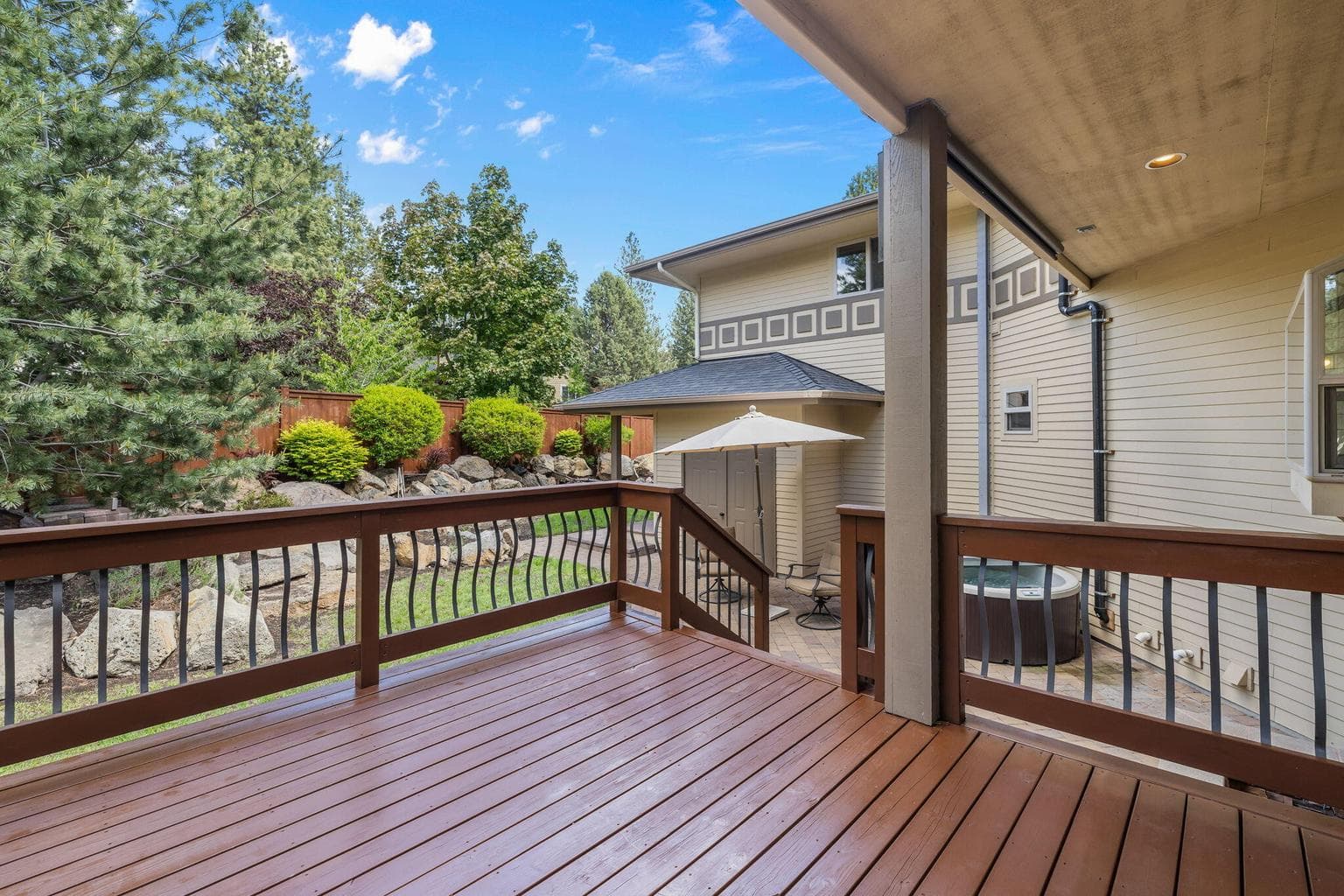 Private deck off Dining leading to patio & back yard