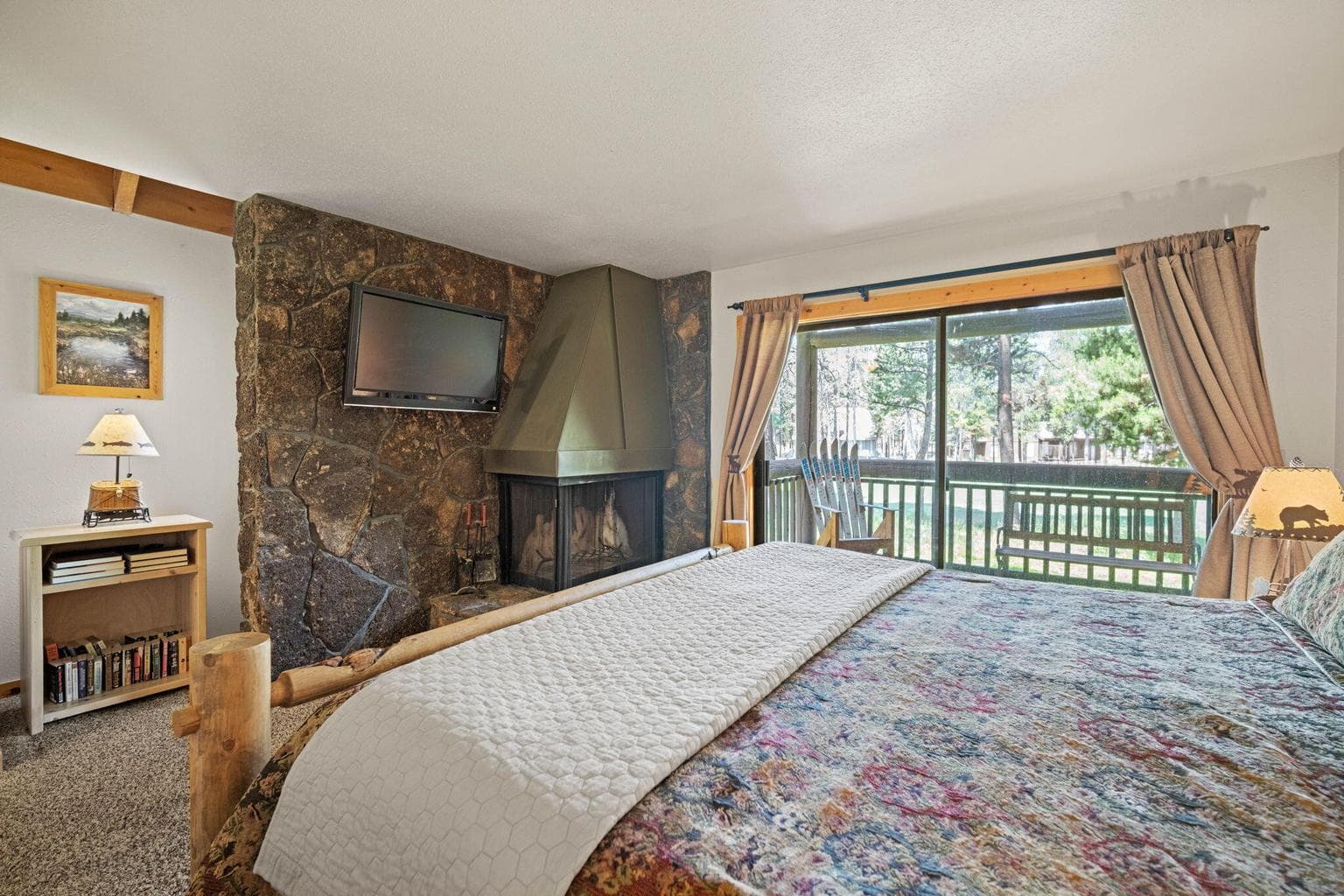 Floor to ceiling natural native lava rock wood burning fireplace