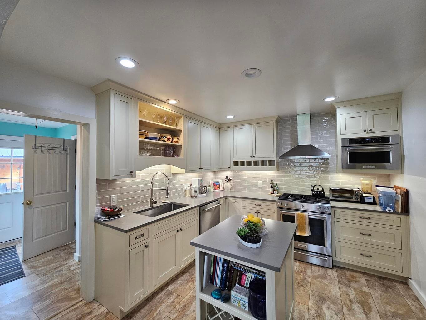 Plenty of light and center island with wine rack