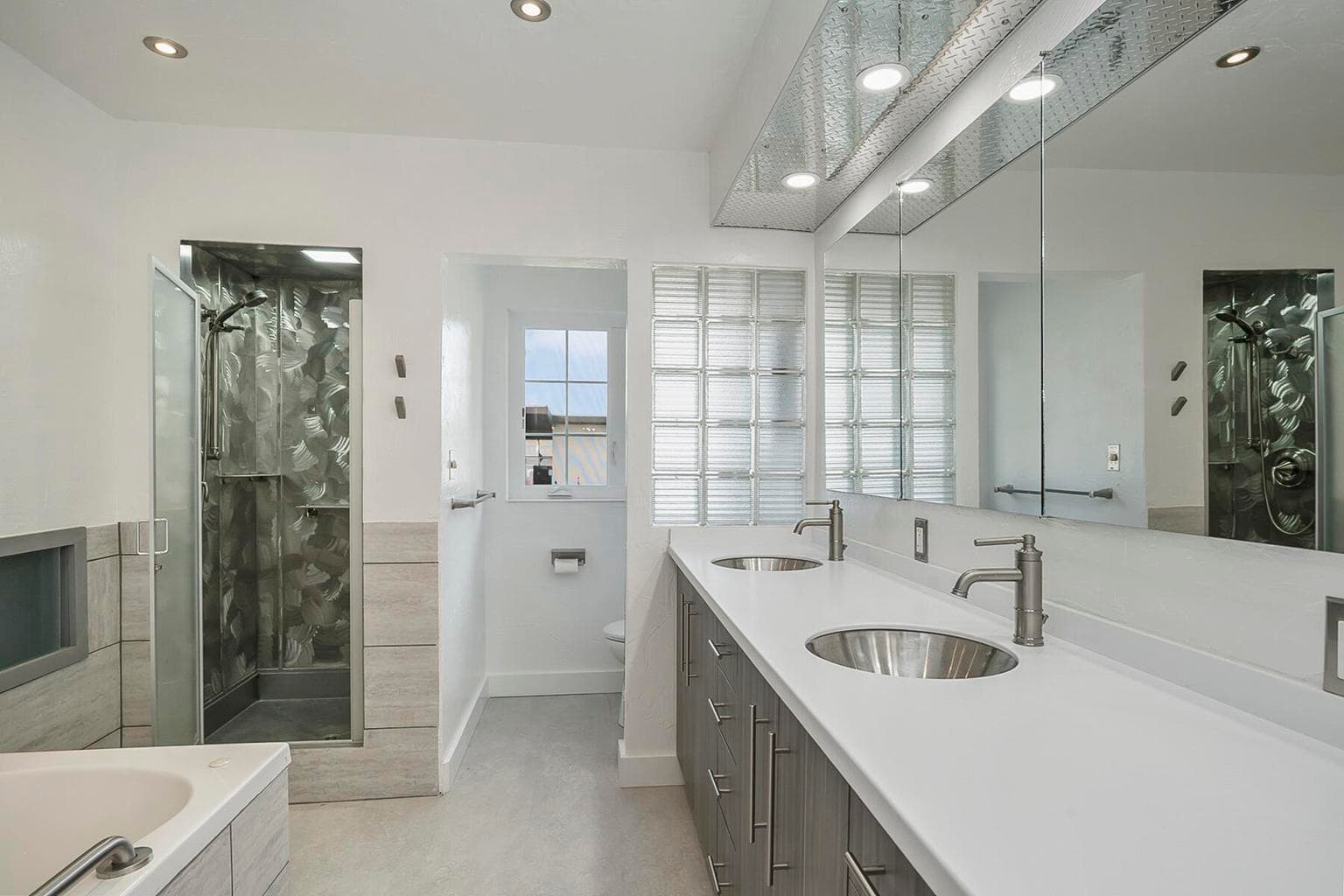 Main bathroom has jetted tub/stall shower/double sinks