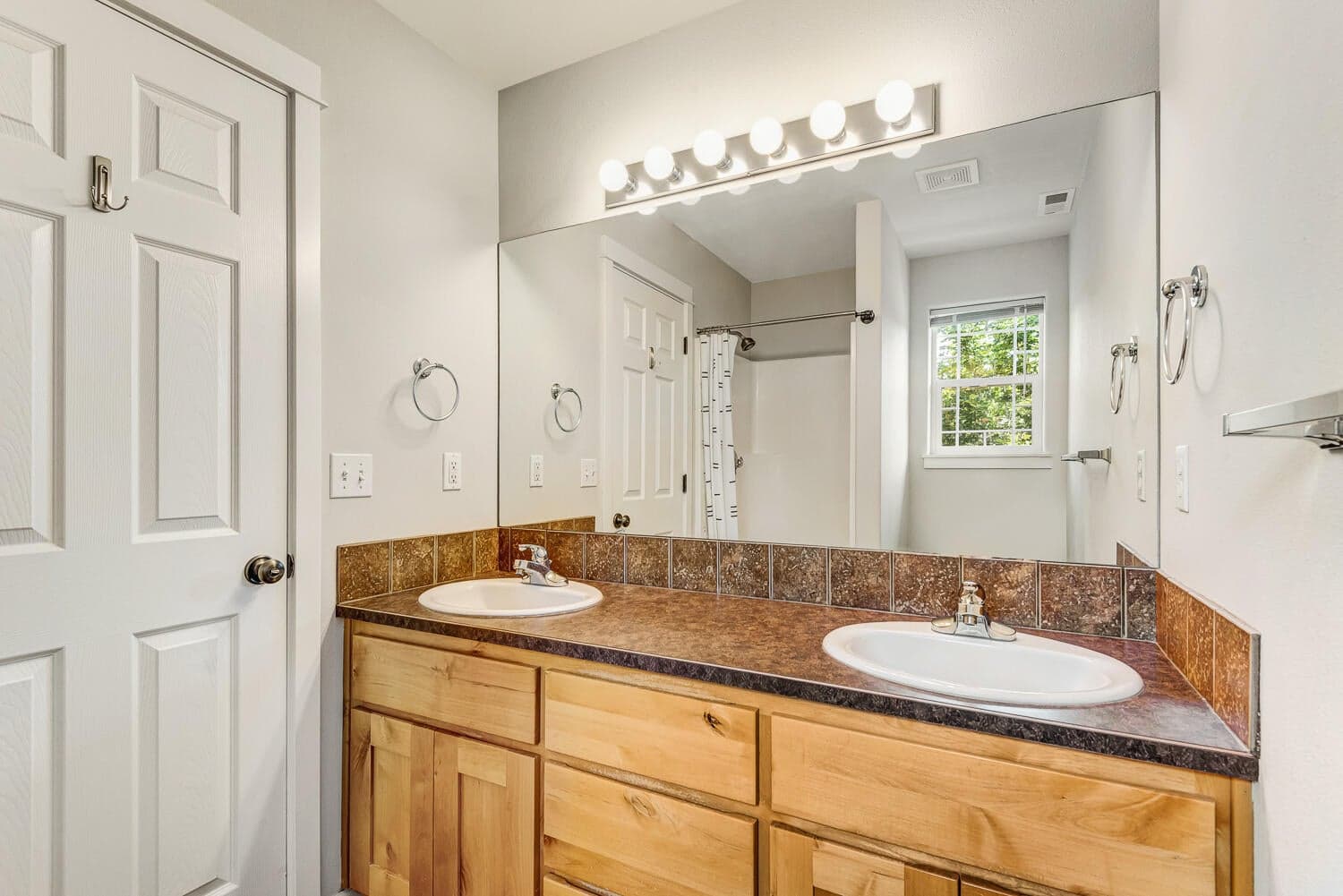 Primary bathroom with dual vanities
