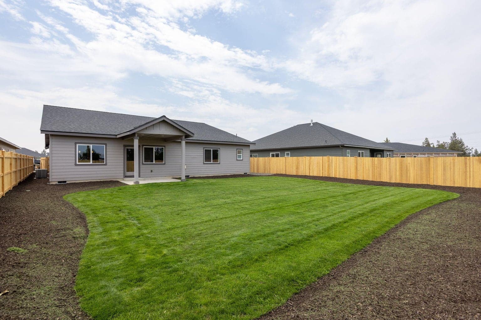 Large backyard with covered patio
