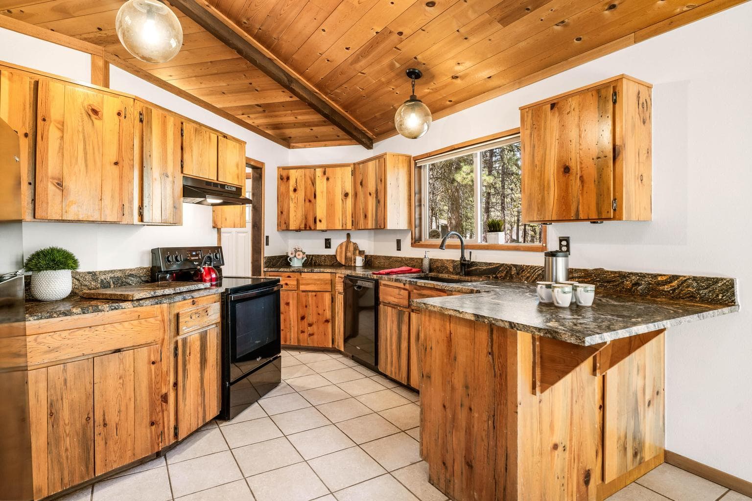 Natural finishes, lots of storage and plenty of prep space make the kitchen just perfect for hosting!