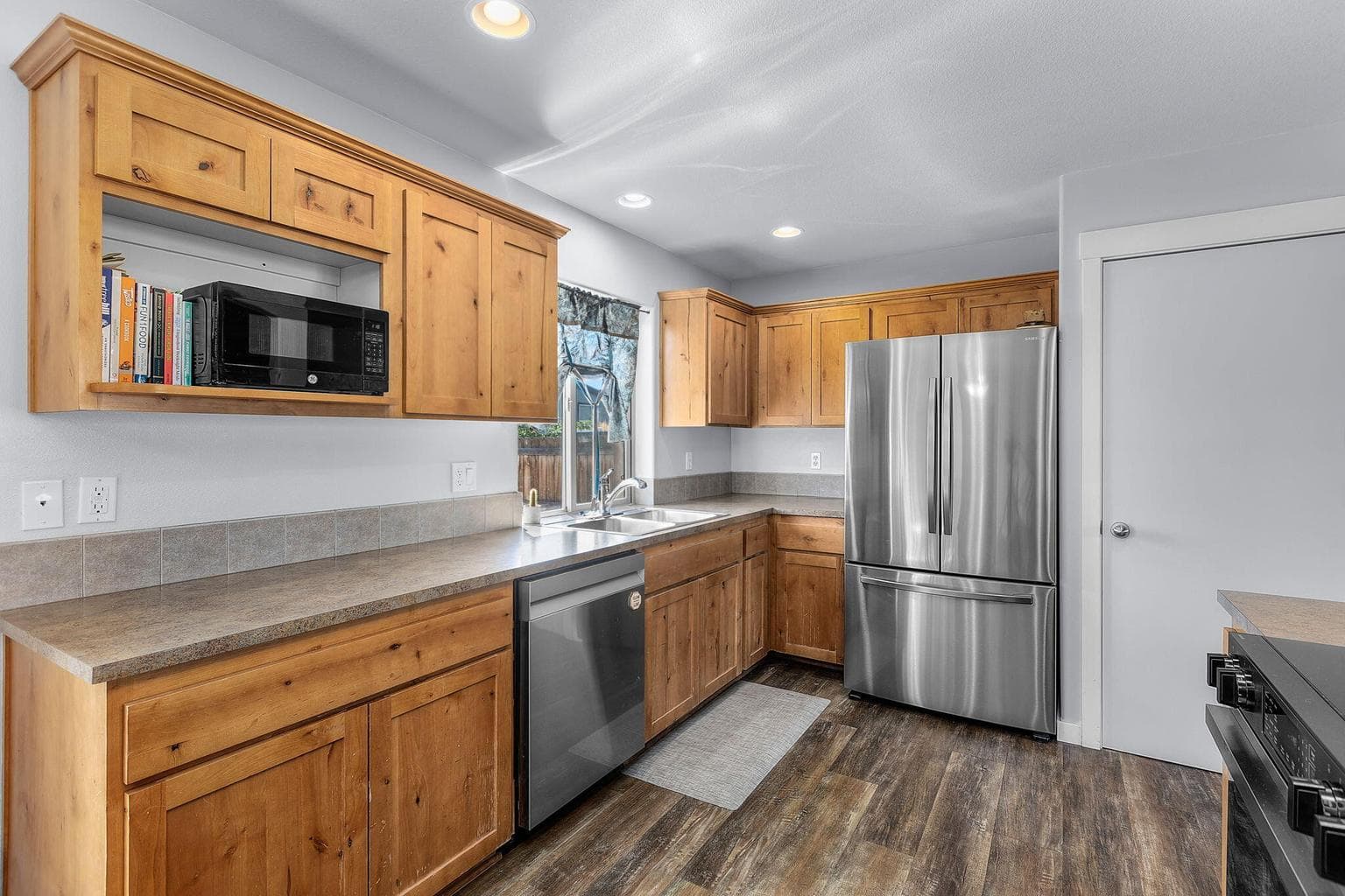 Expansive countertop space, large pantry & window overlooking the back yard.