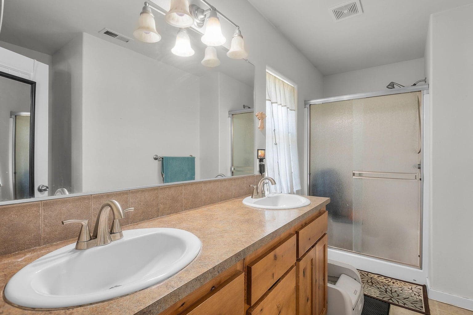 Double vanities & step in shower.