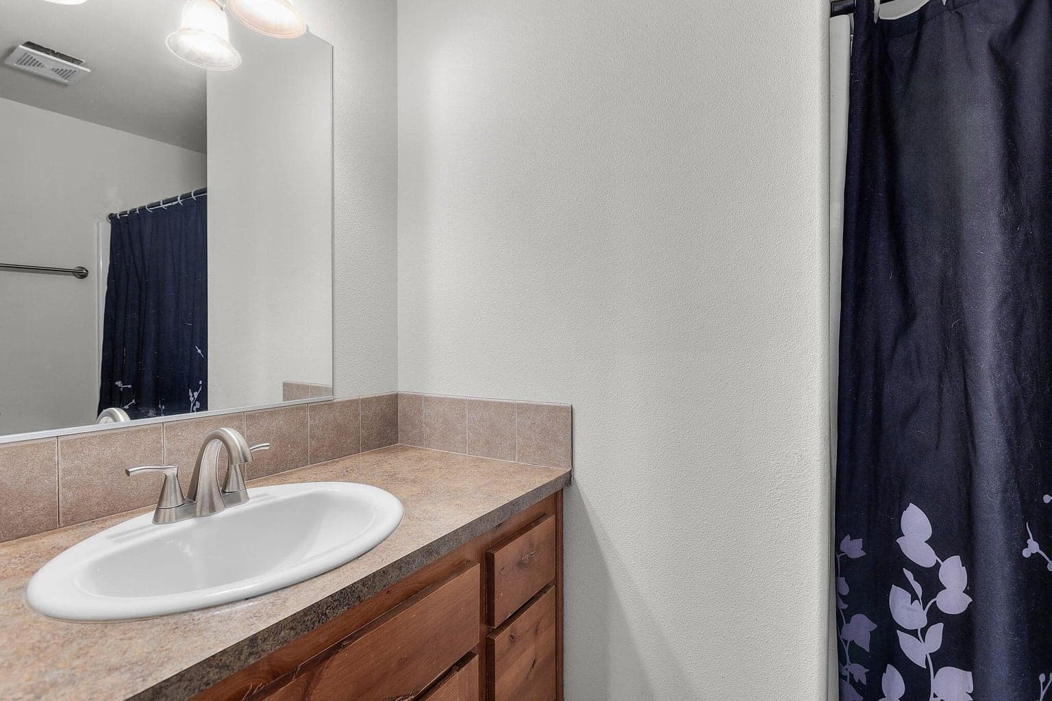 Guest bath w/tub shower combo.