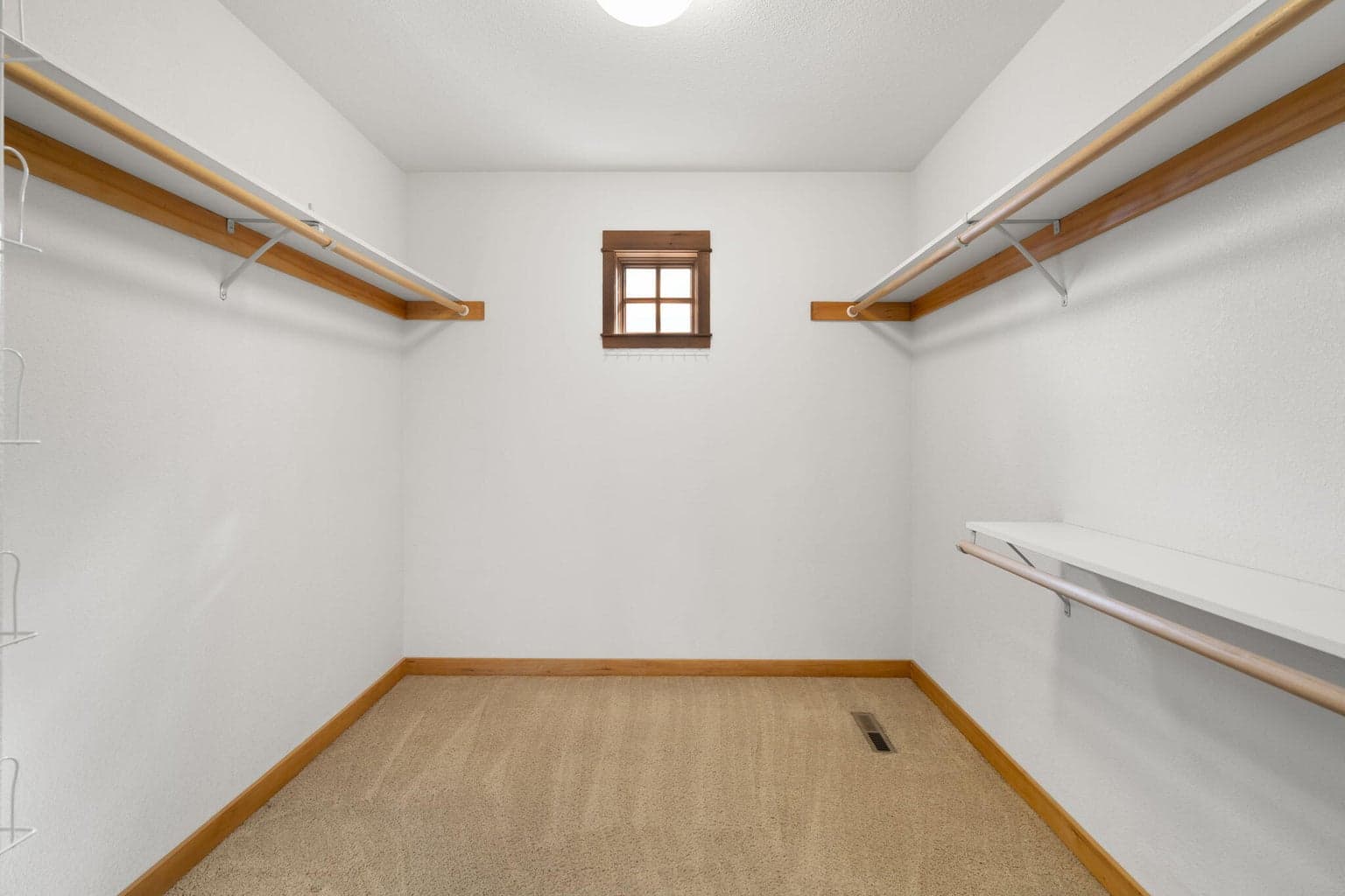 The primary closet provides plenty of space.
