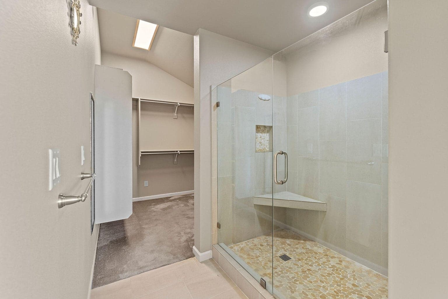 Tile walk in shower with glass doors