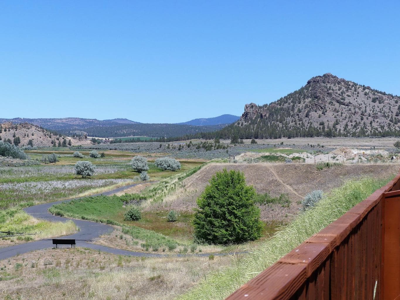 Archive photo of the north side of the community, the Ochoco Pointe paved walking path, and public trail areas. Photo from pre-development of phases 3-5.