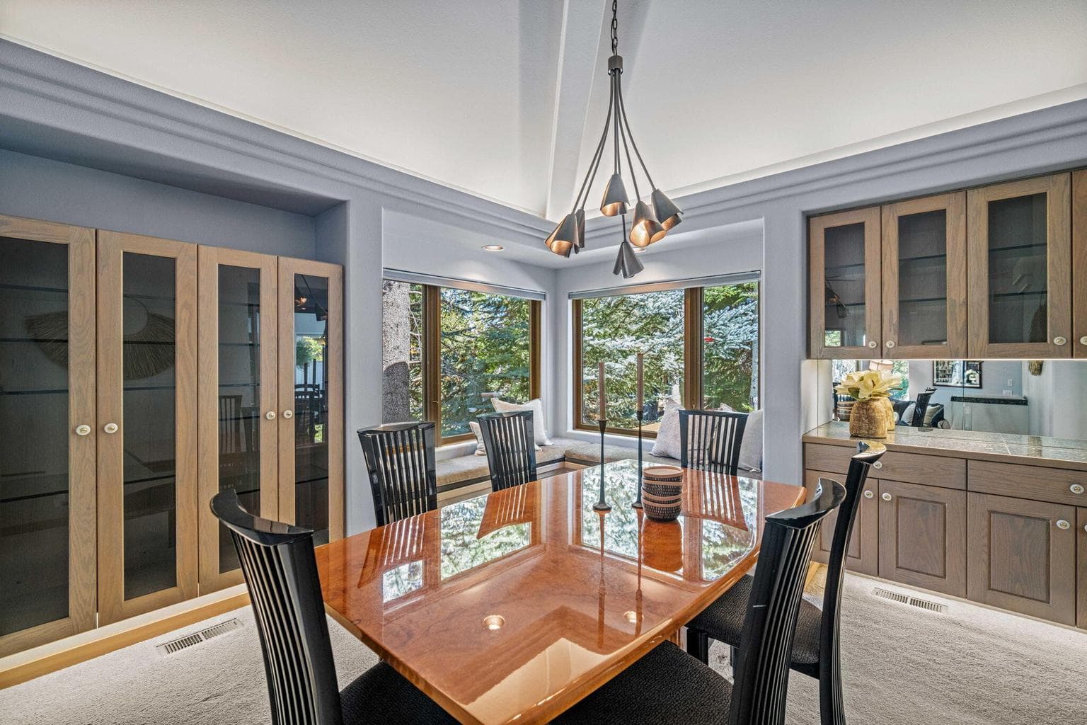 Dining room surrounded by custom customs and window seat