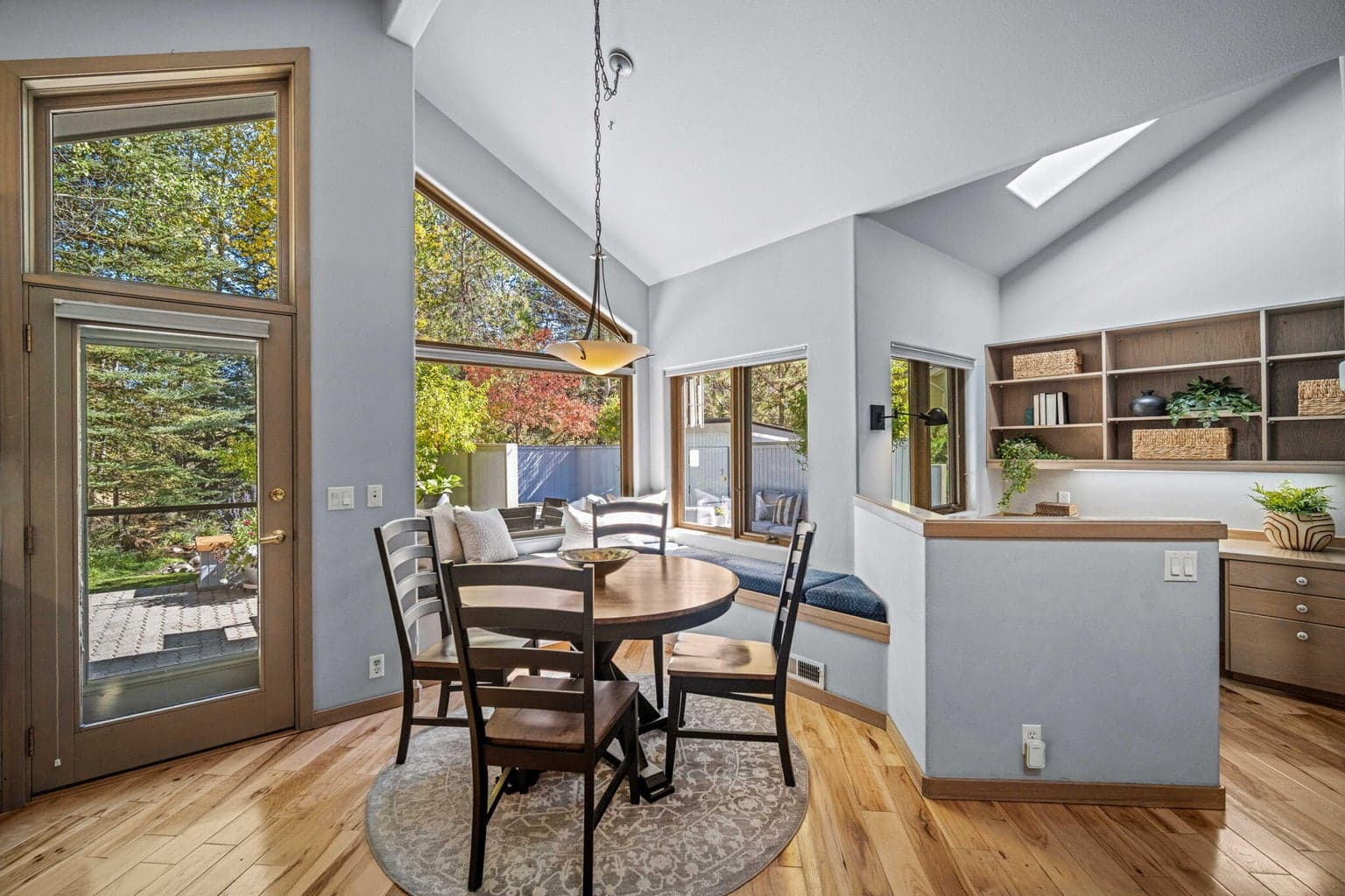 Large windows and door allow so much light and access to the outdoor living space