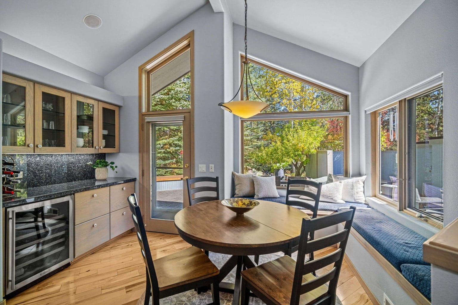 Wine refrigerator, custom builtins and comfy window seat
