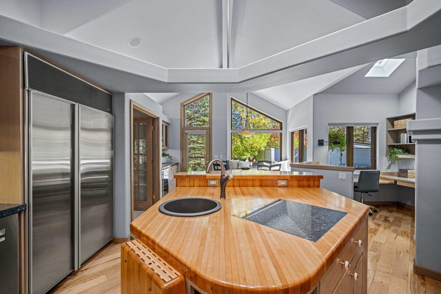 Custom designed wood island with prep sink, SubZero refrigerator and newer Bosch dishwasher