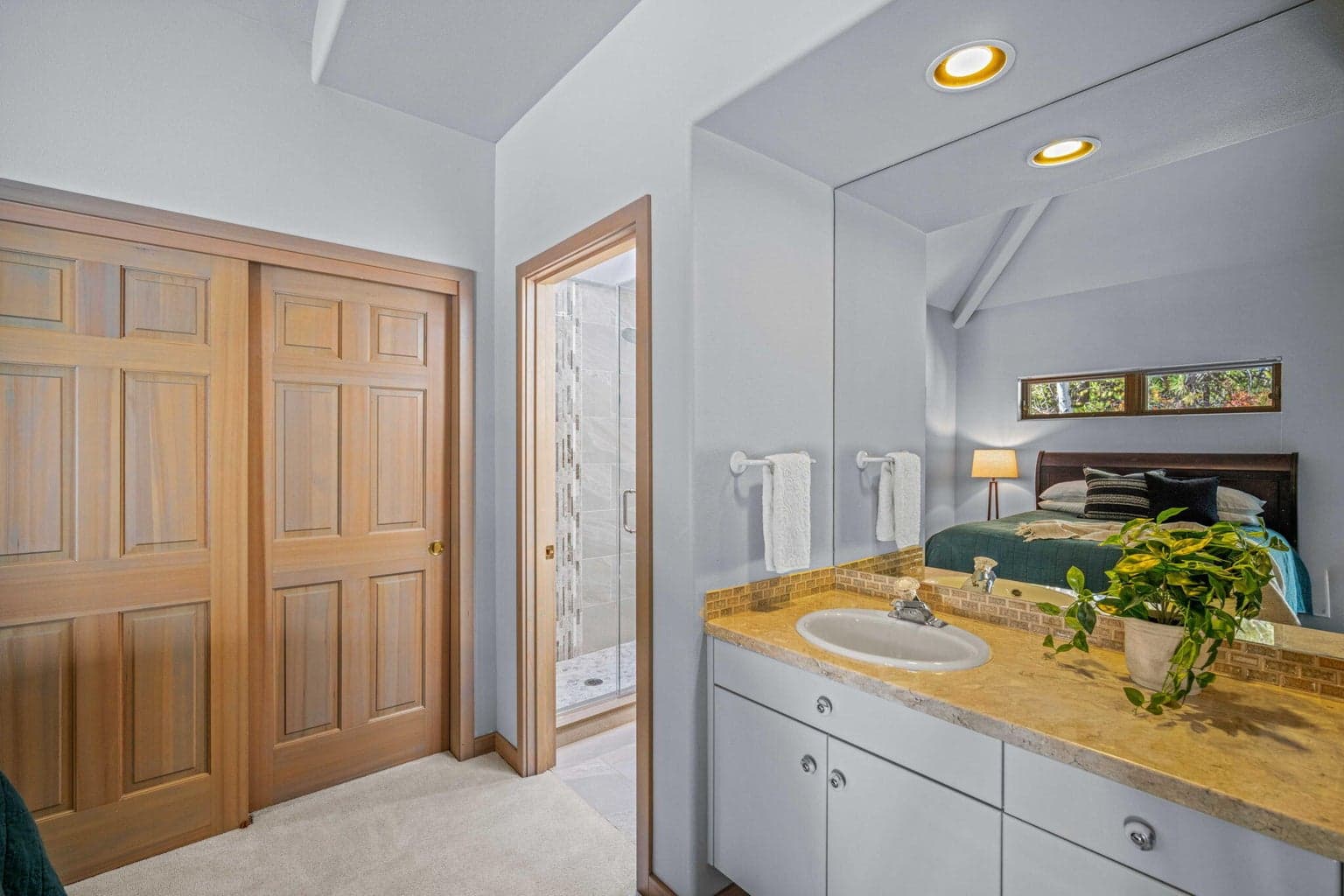 Spacious closet and private sink then entry to the jack n jill bath