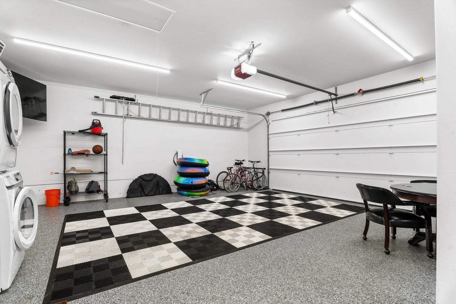 Currently set up as a games room, the garage also sports a second set of laundry appliances to help you host fabulously!