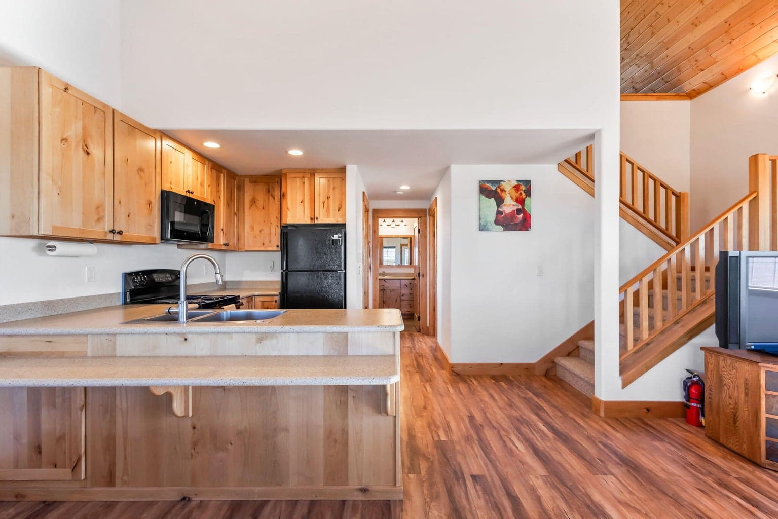 Great room & kitchen with vaulted ceiling