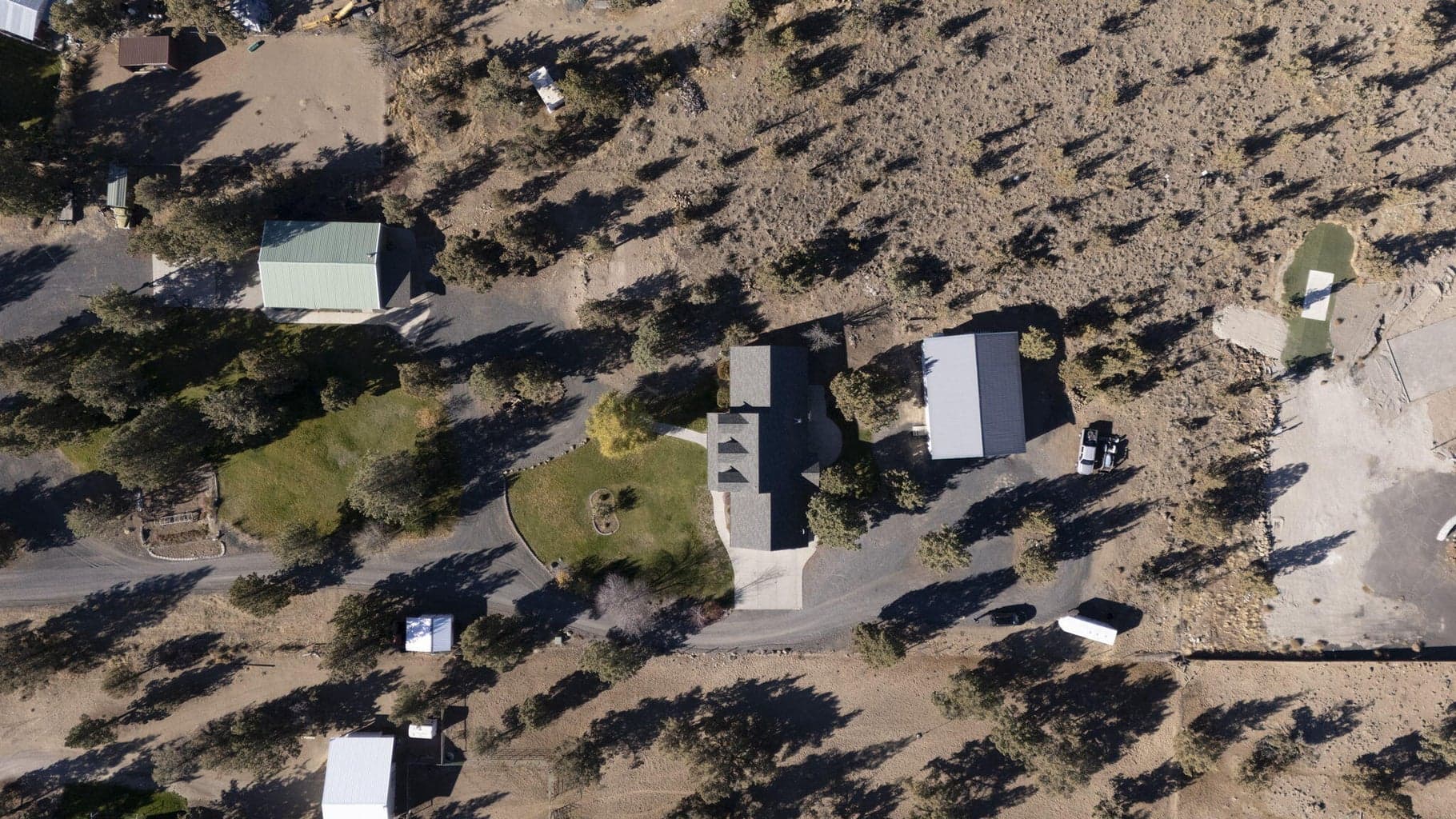 From L to R: Green shop, main house, white shop