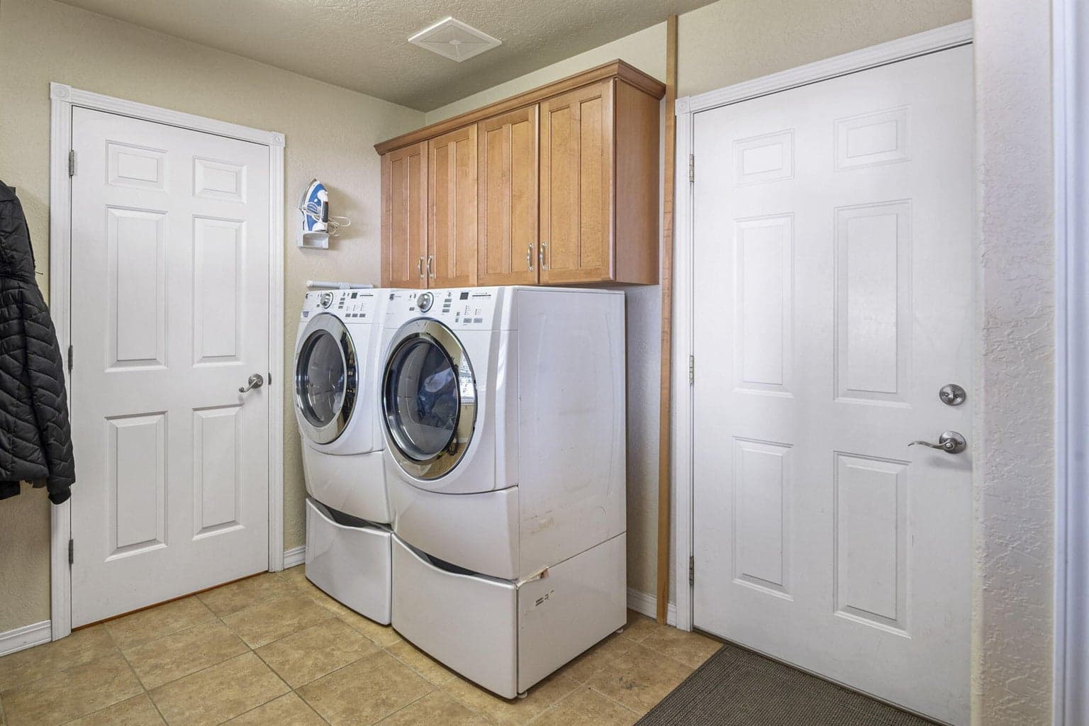 Door to the right is garage. Left door is 1/2 bath