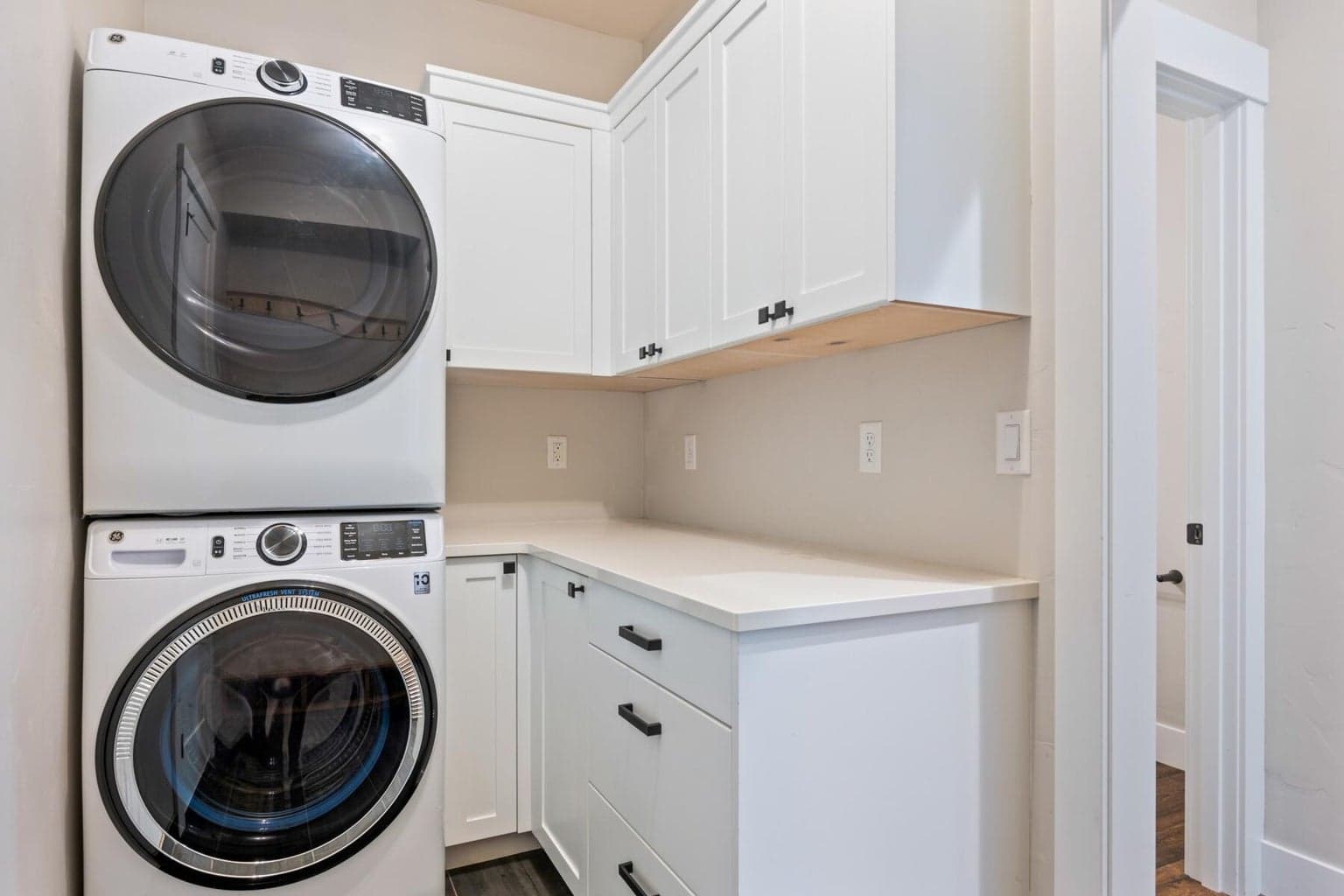 Stackable washer/dryer laundry area