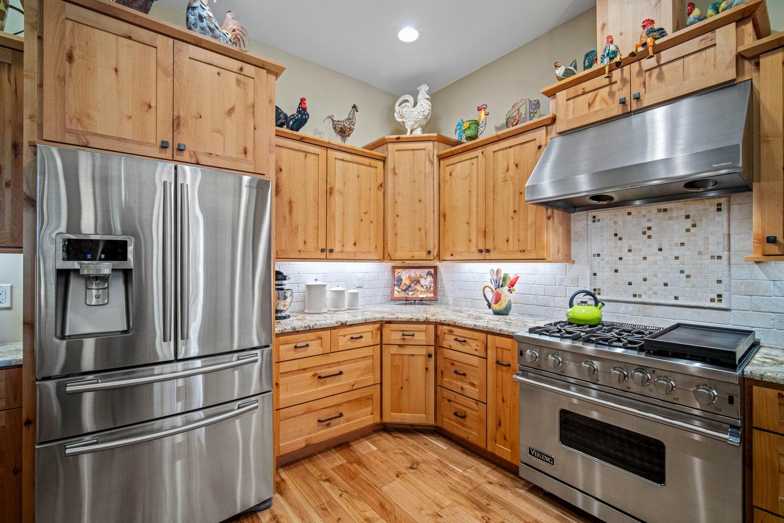 High-end stainless appliances with commercial range. Custom knotty alder cabinetry with soft close doors and drawers.