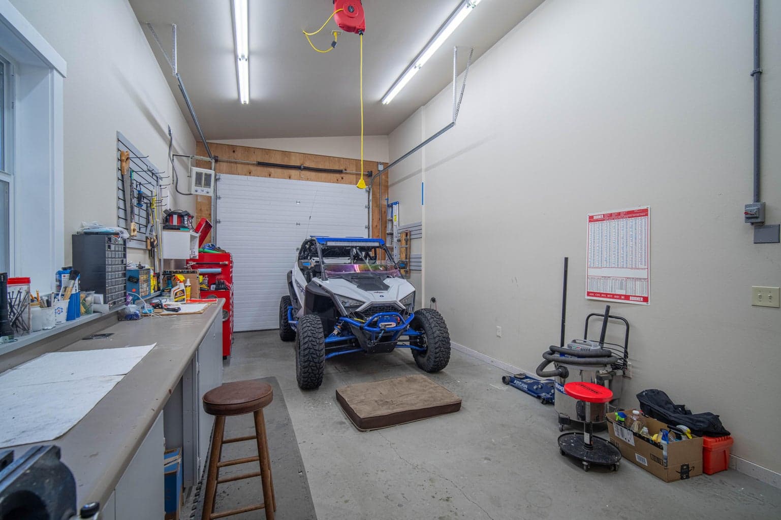 One of the three bays is completely finished and heated with a full bath and an office.