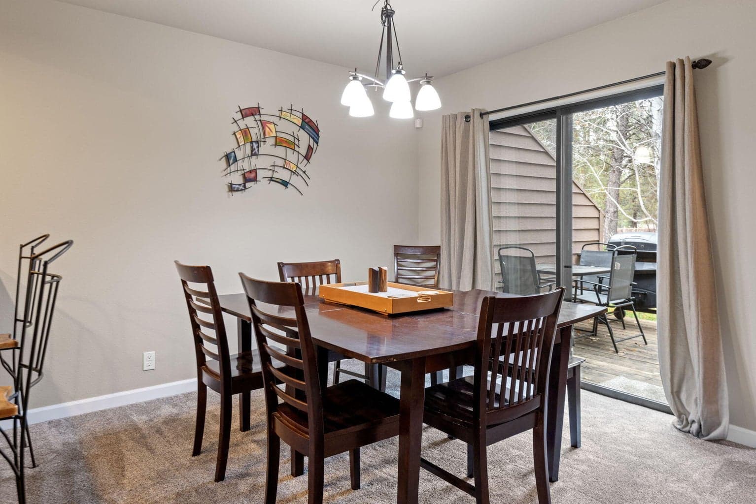 Dining space with access to the deck and included barbecues.