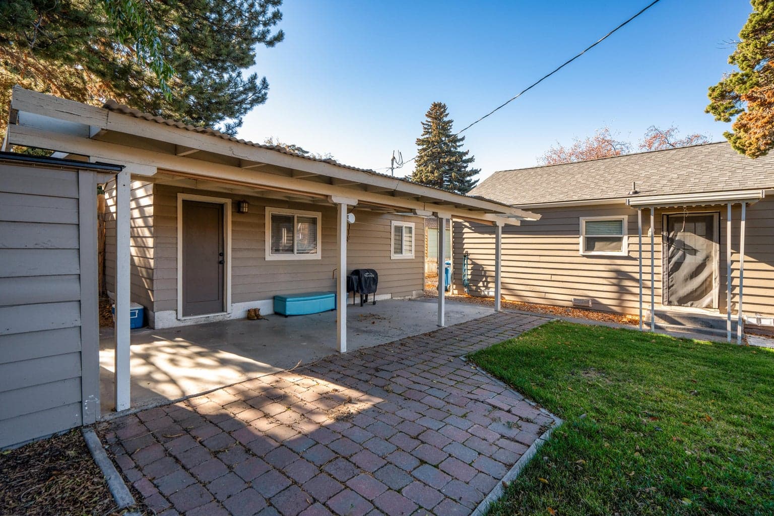 ADU has access to the concrete pad up to the posts on the porch and 1 shed, Yard is the main house.