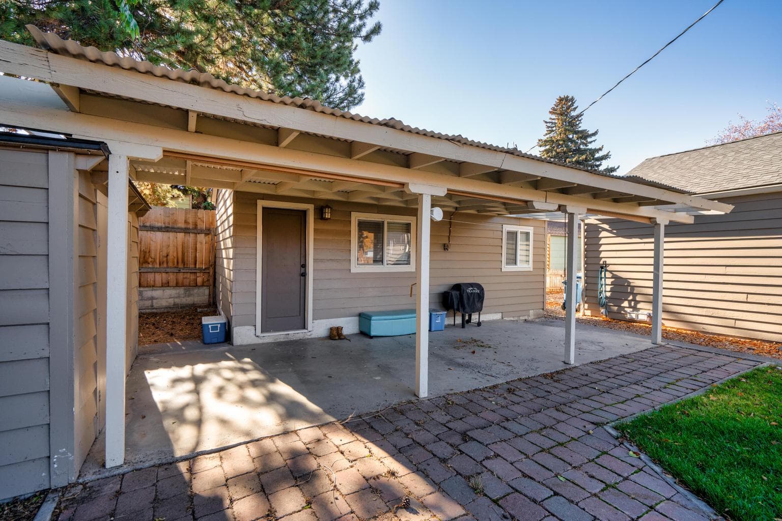 ADU has access to the concrete pad up to the posts on the porch and 1 shed, Yard is the main house.
