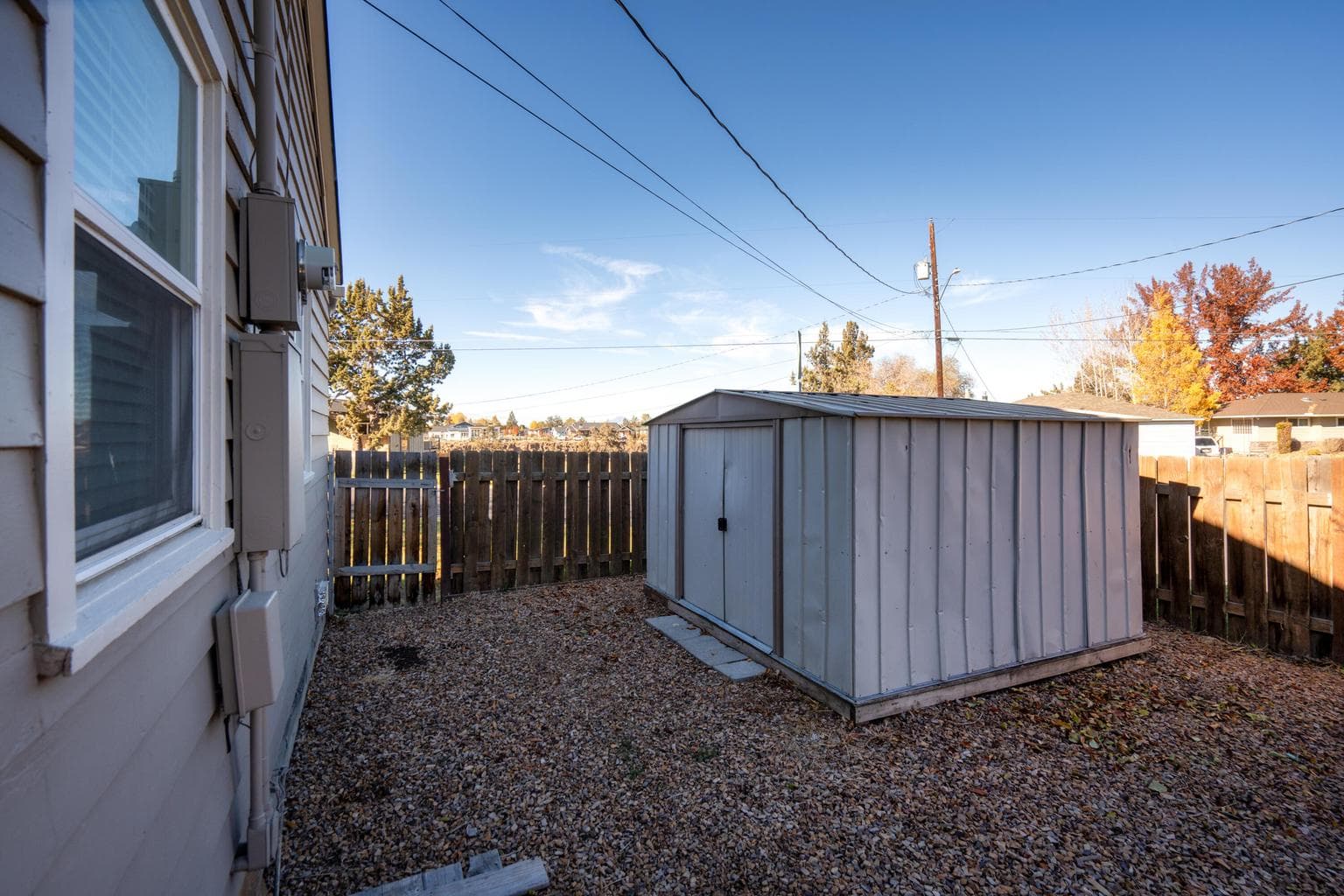 ADU has access to the concrete pad up to the posts on the porch and 1 shed, Yard is the main house.