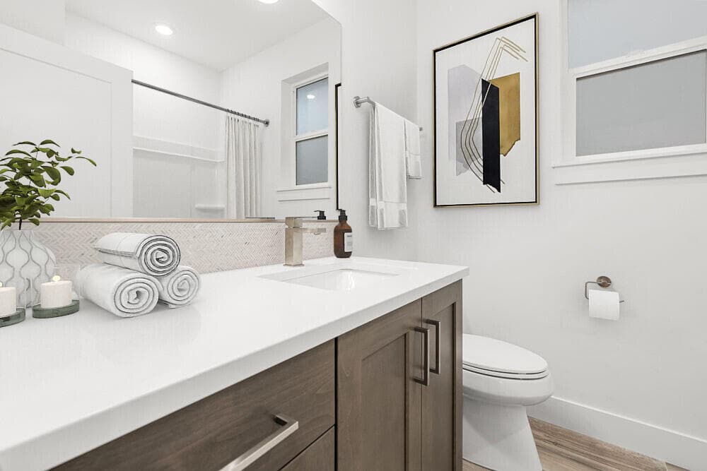 Hall bath. Photos have been virtually staged.
