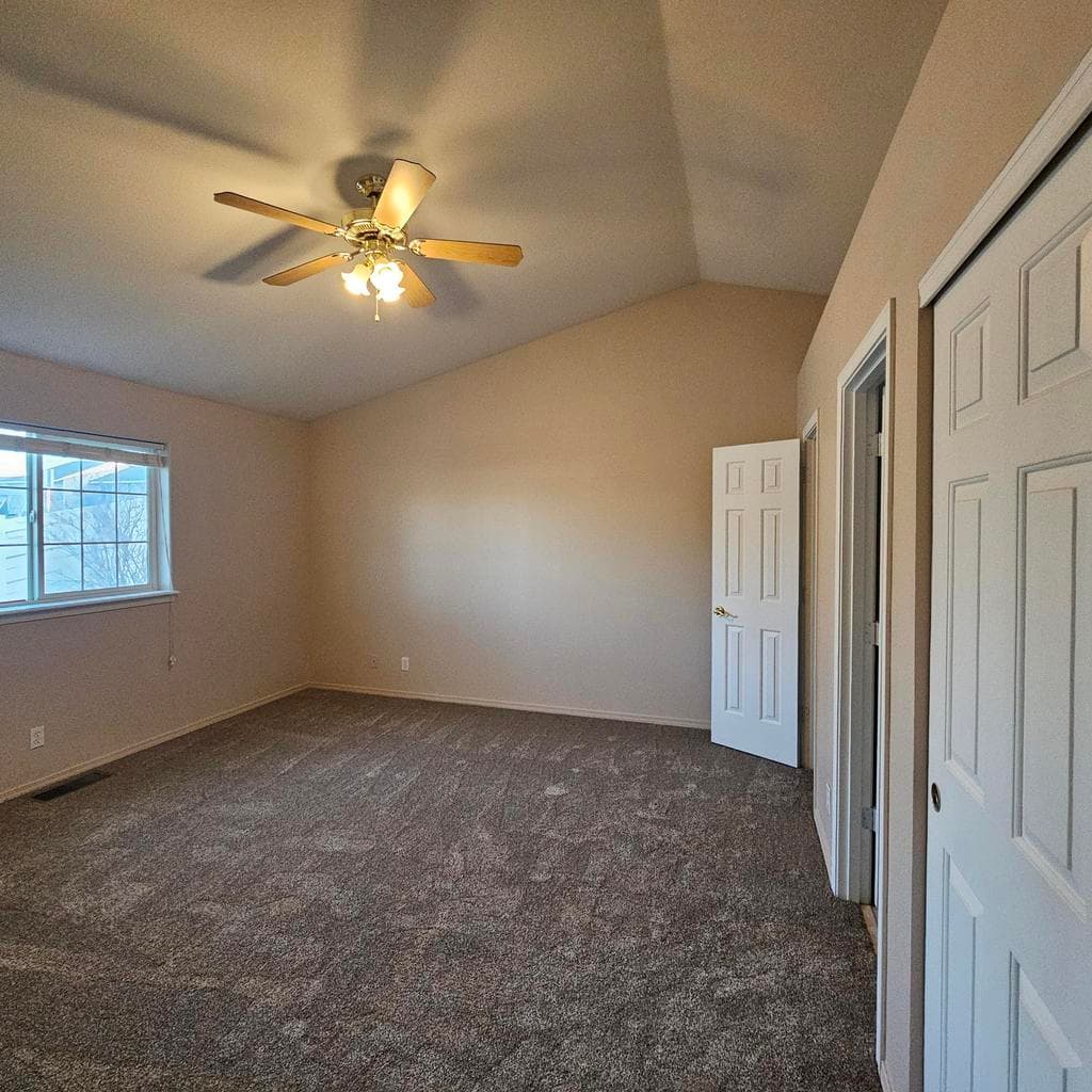 Primary bedroom with ensuite bath and walkin closet.