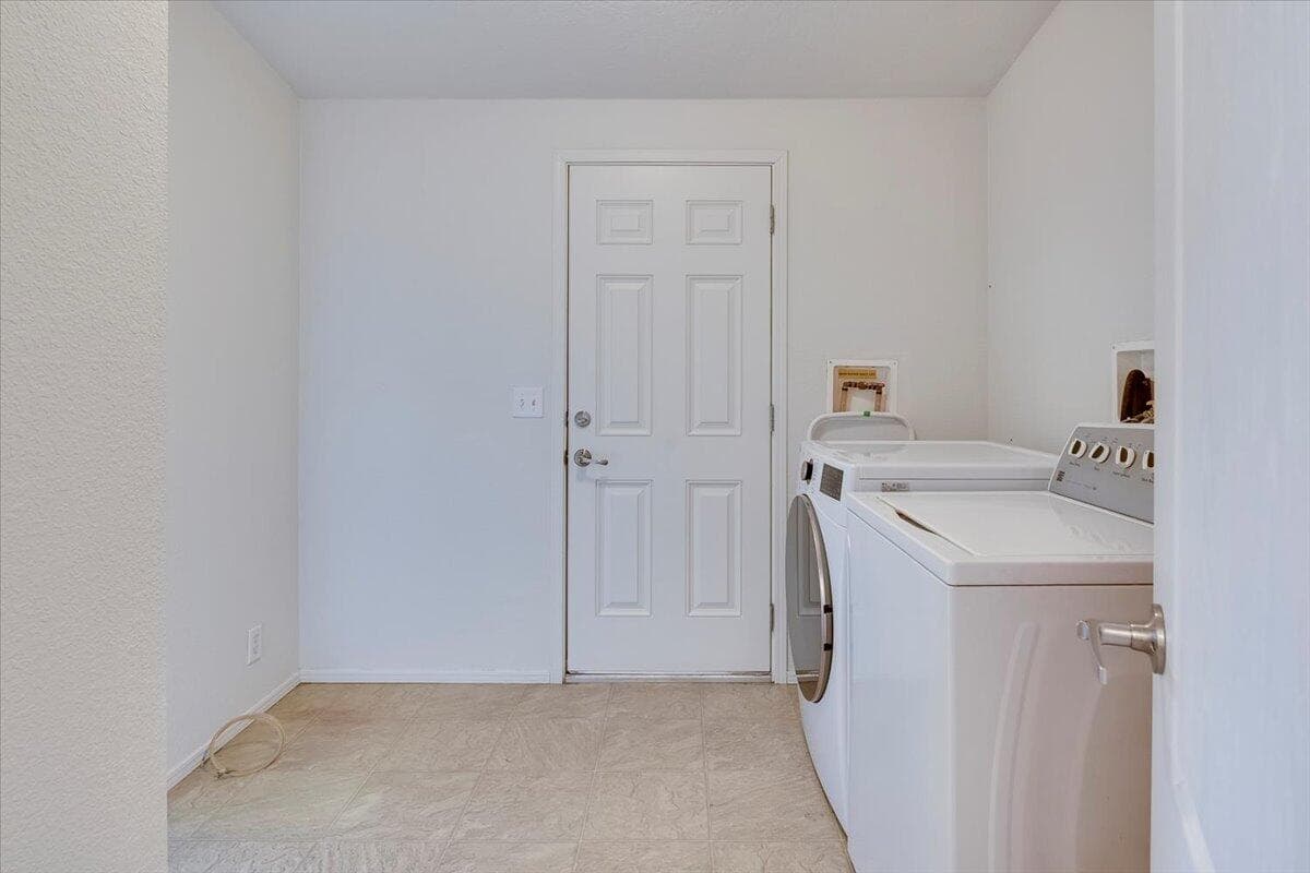 Utility room entrance to carport