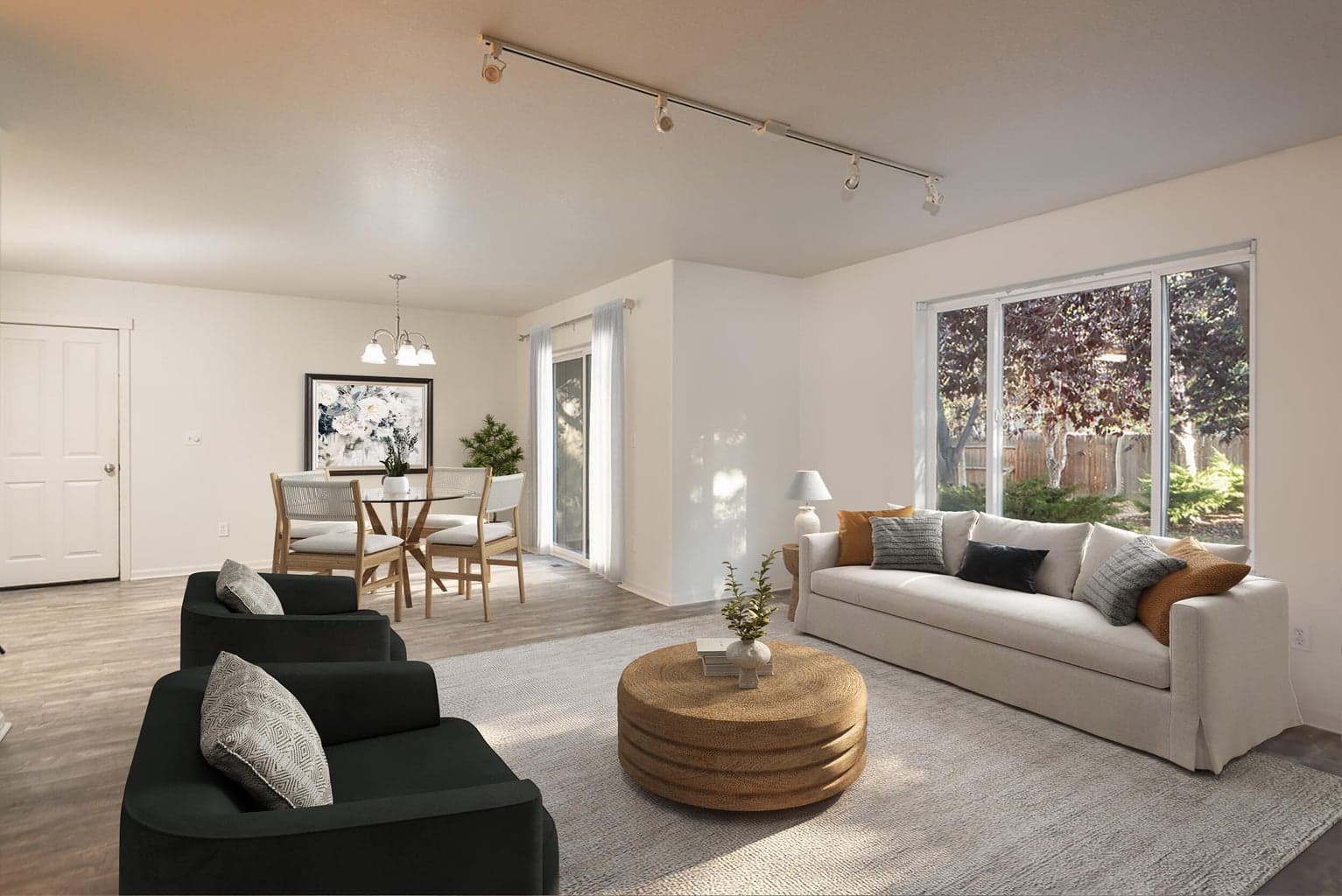Open floorplan with windows overlooking the expansive backyard.