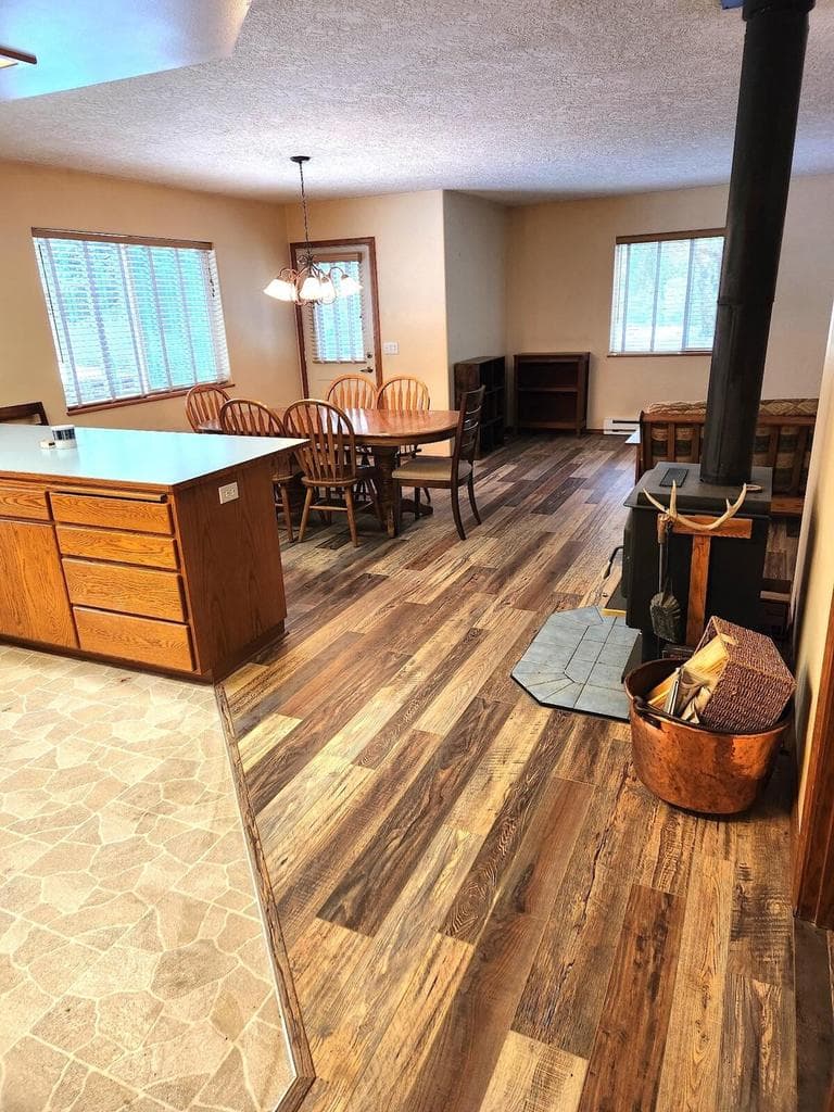 UPDATED PIC-New wood laminate flooring in great room/hallway