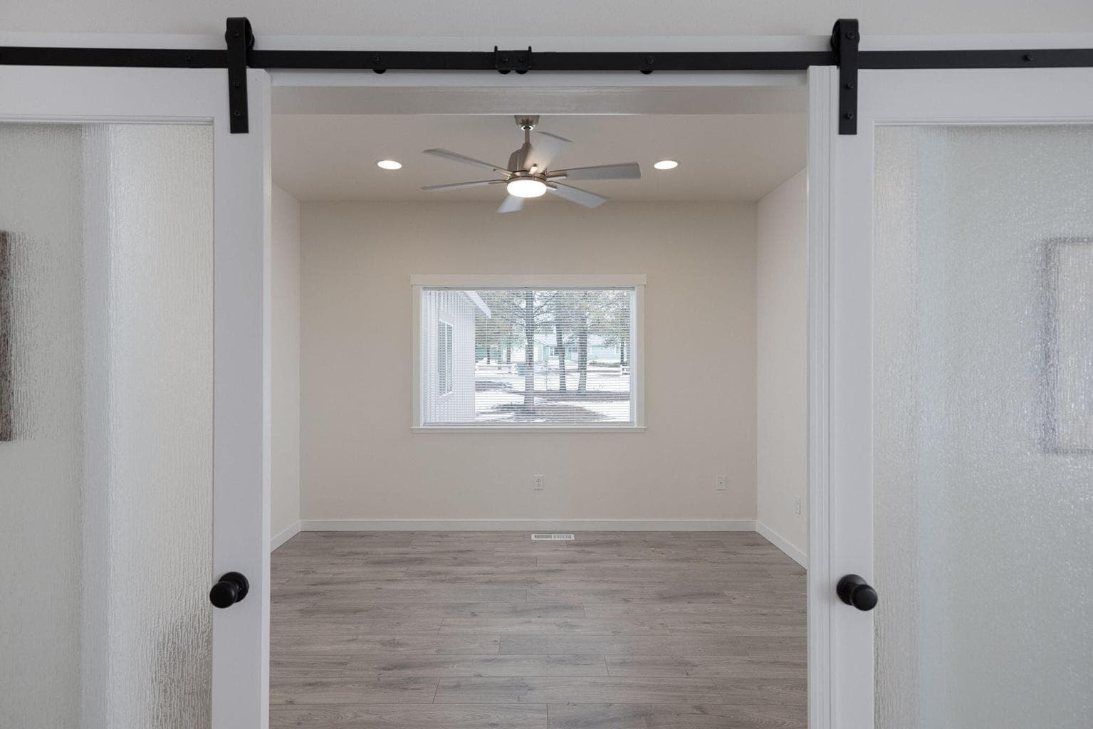 office with barn door entry