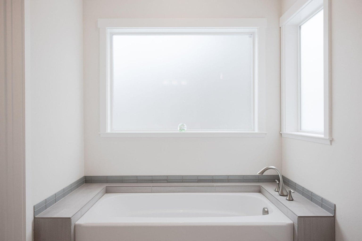 Soaking tub in primary suite