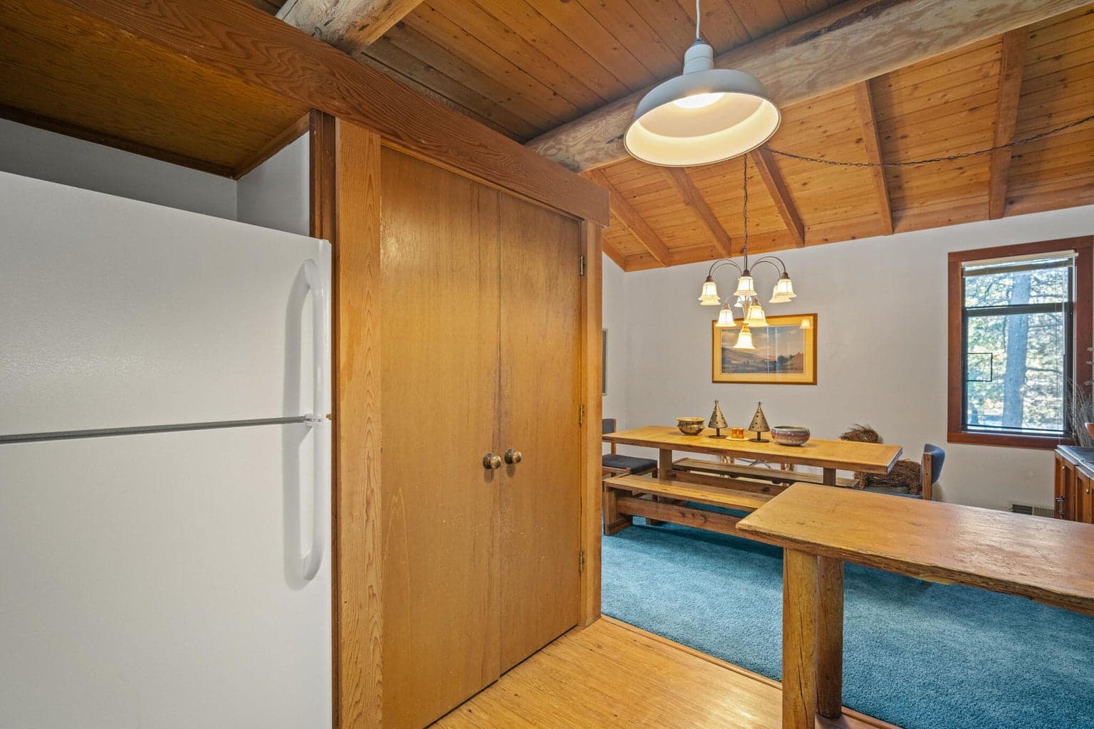 Pantry to the right of the refrigerator