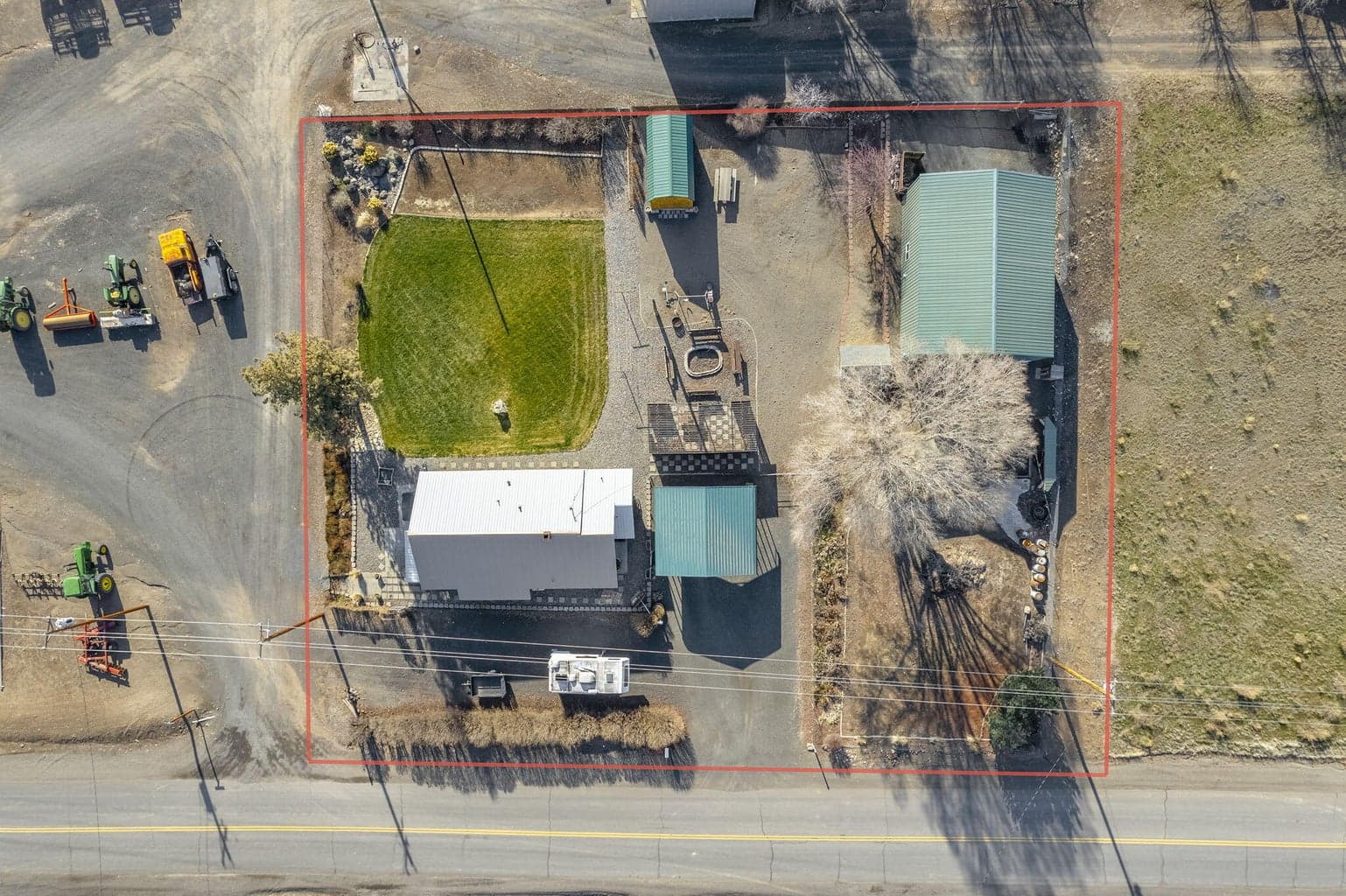 Bird's-eye view of the 0.59-acre lot, home, and shop.