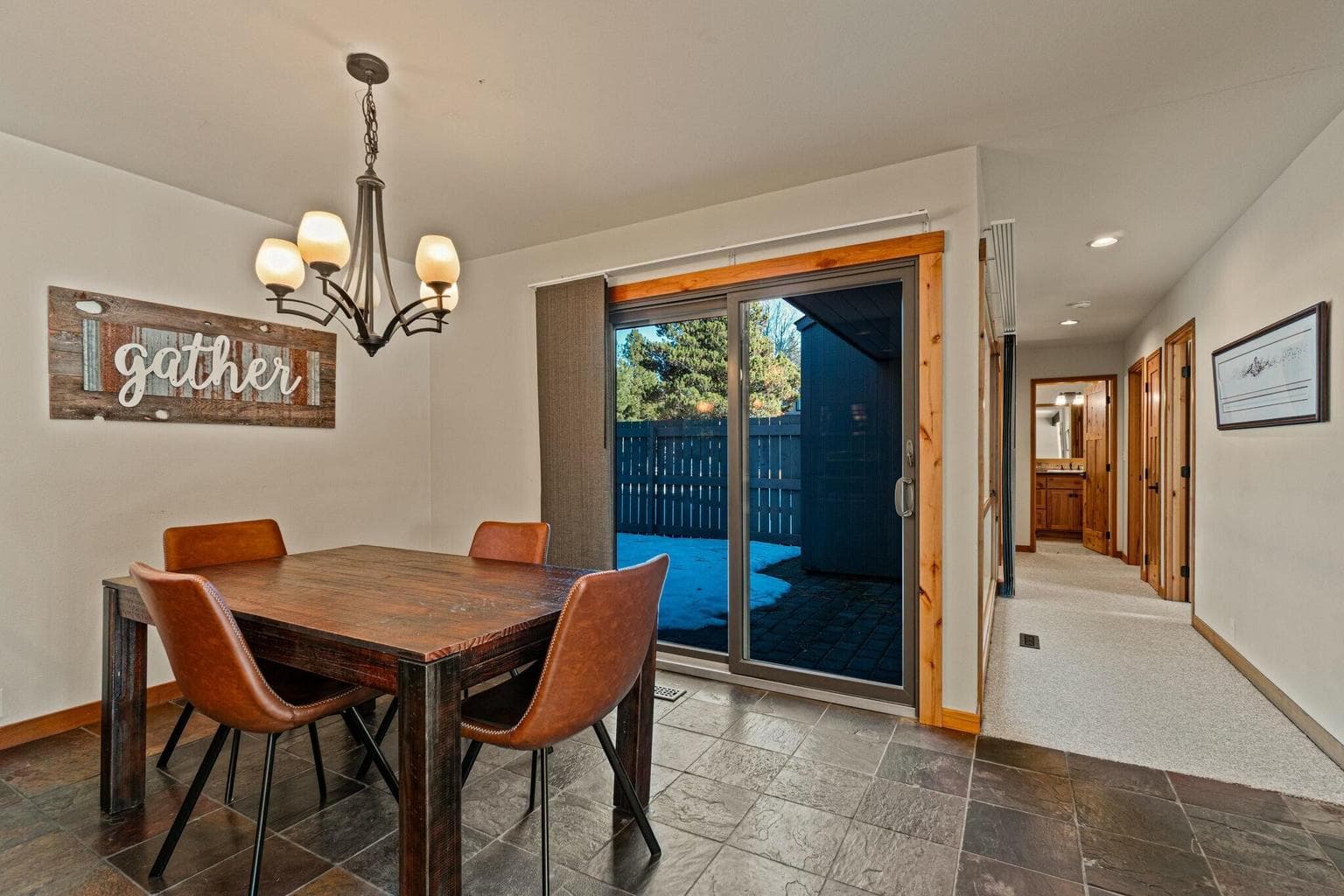 Access out to enclosed paver patio for dining and entertaining options.