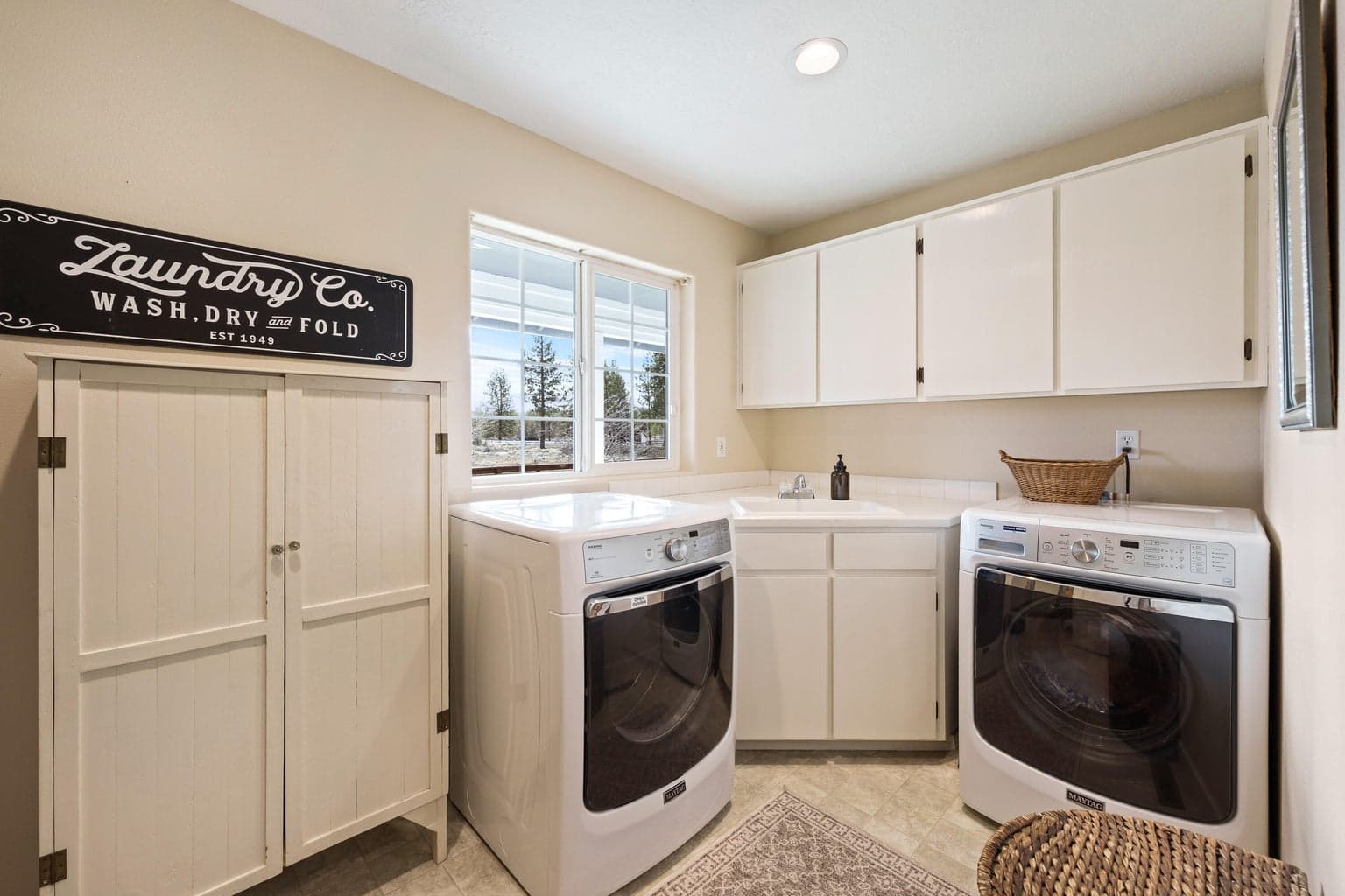 Spacious laundry room with sink