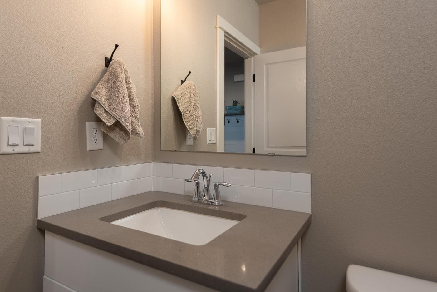 Downstairs half bathroom off the hall
