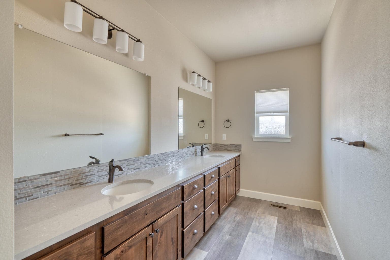 Airy, Well-Appointed Primary Bath with His & Hers Sinks