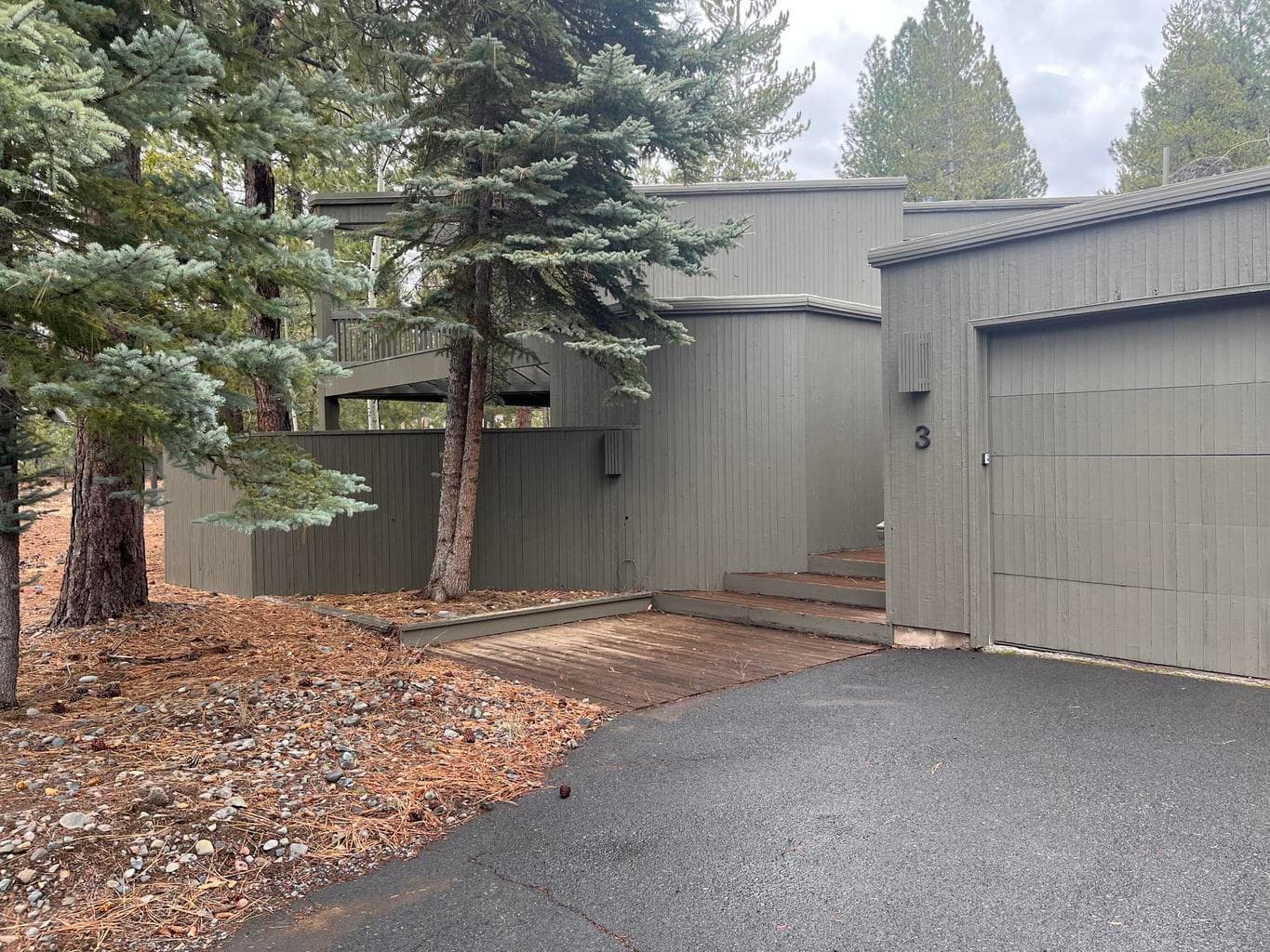 Entrance and Driveway to home on a quiet street. Detached garage on the right.