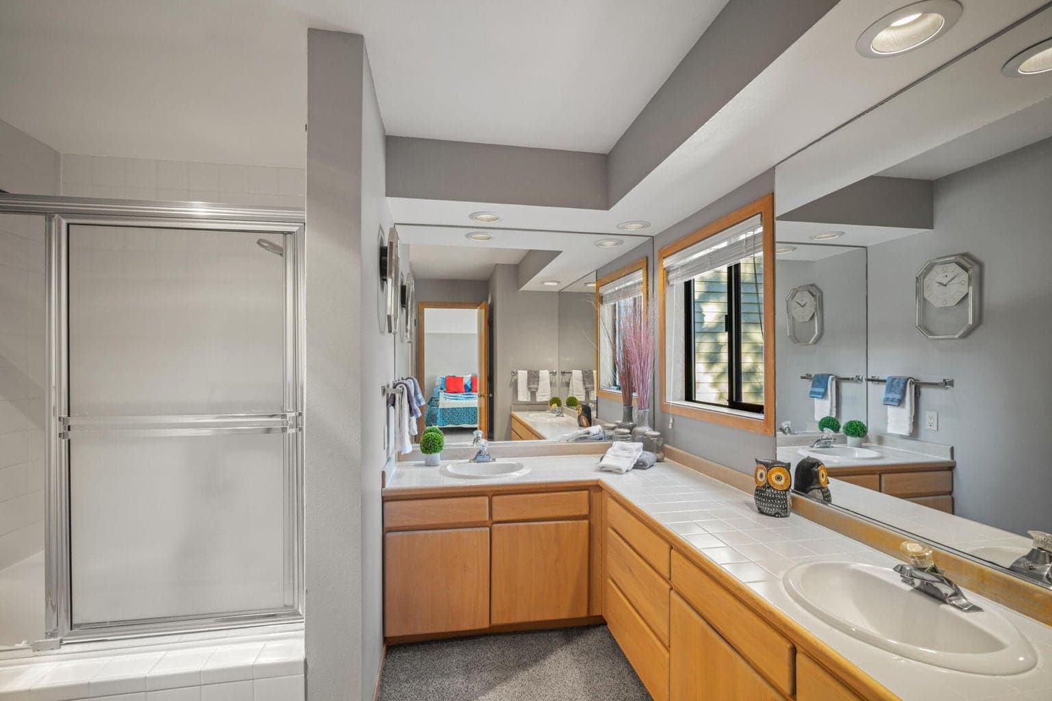 Oversized primary bathroom with dual sinks and lots of counter space